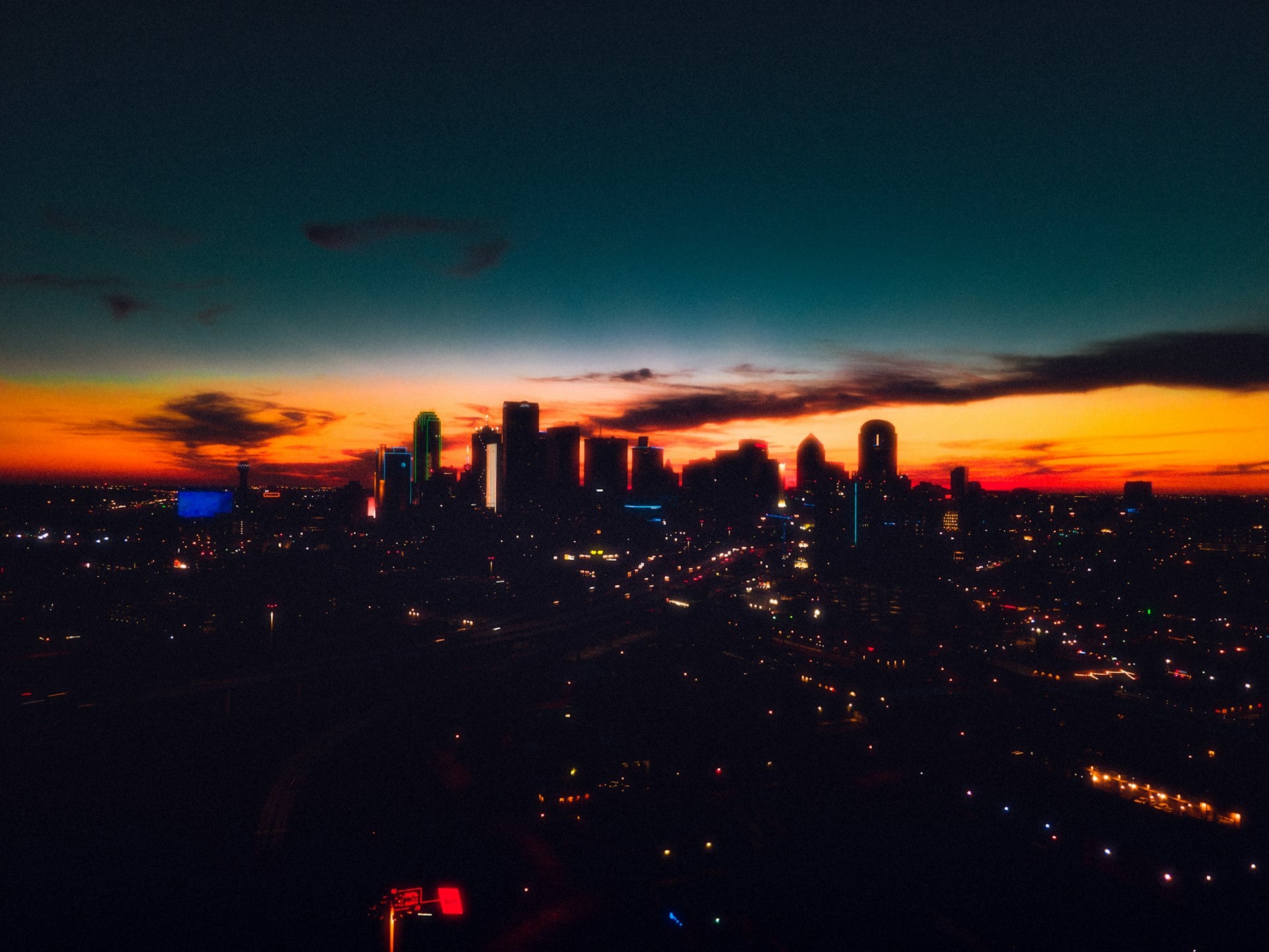 Dallas Fort Worth metroplex skyline at sunset with city lights