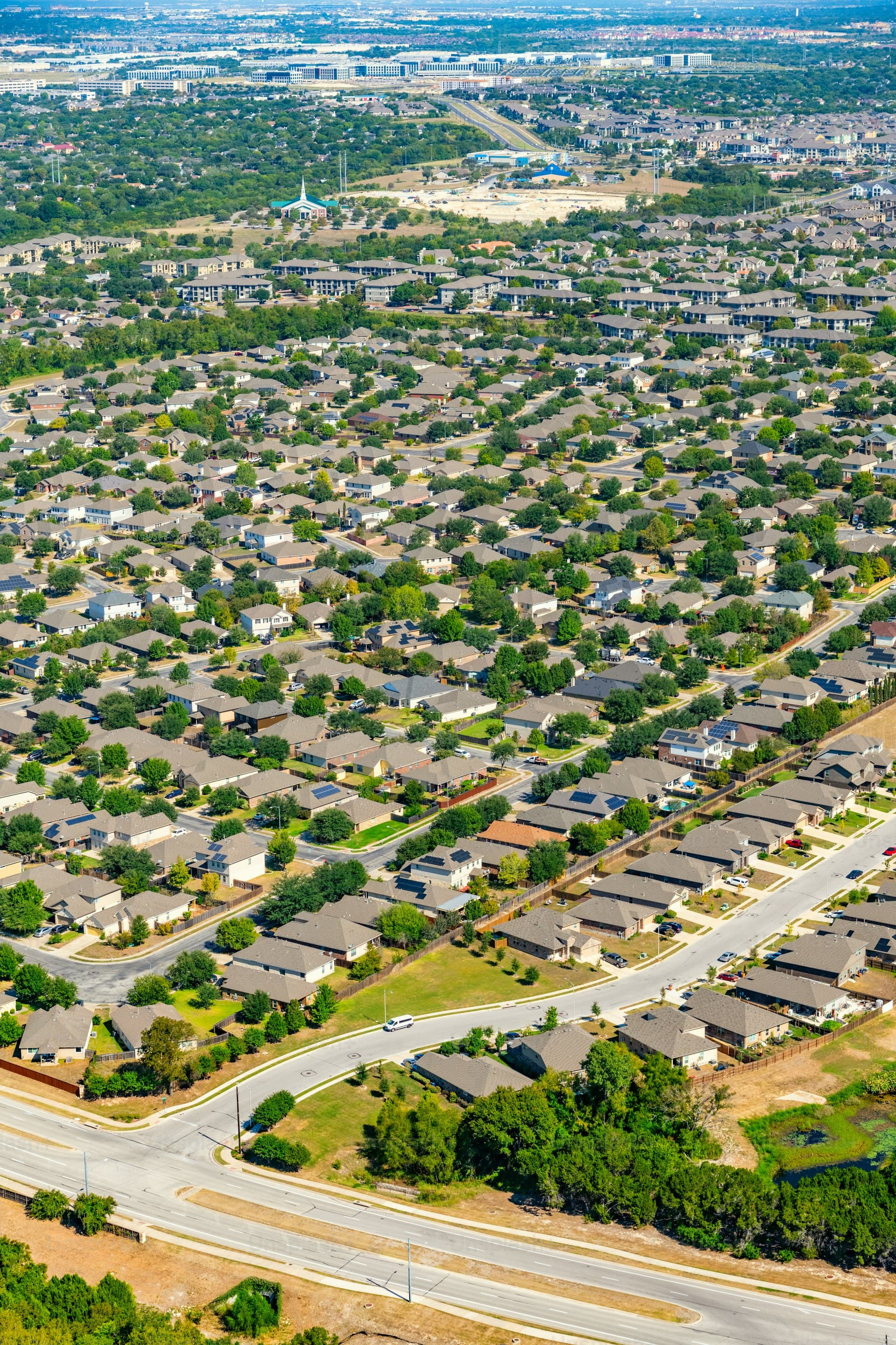 Aerial view of master-planned suburban residential community north of downtown Austin Texas