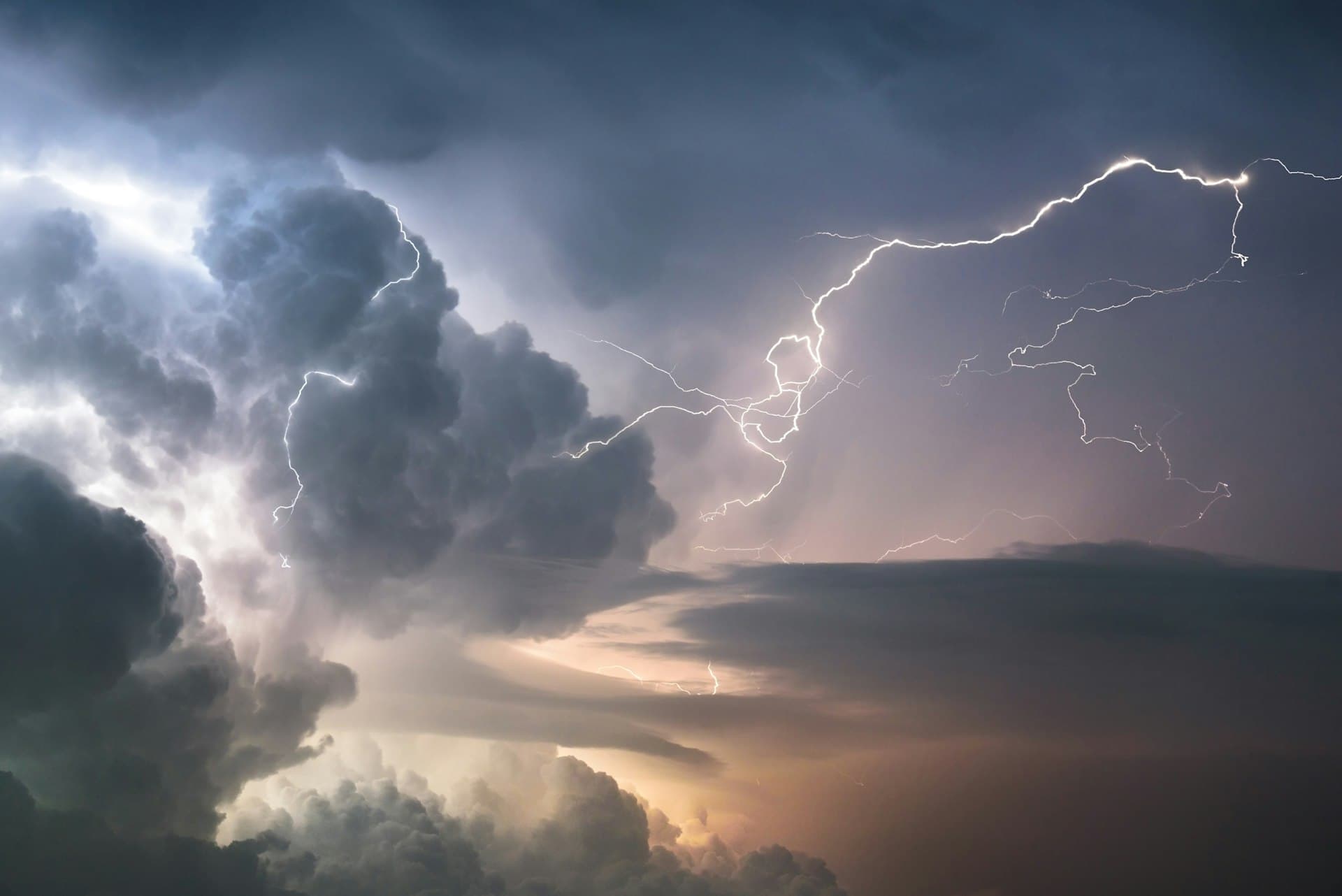 Dramatic lightning strike illuminating stormy clouds during Texas thunderstorm
