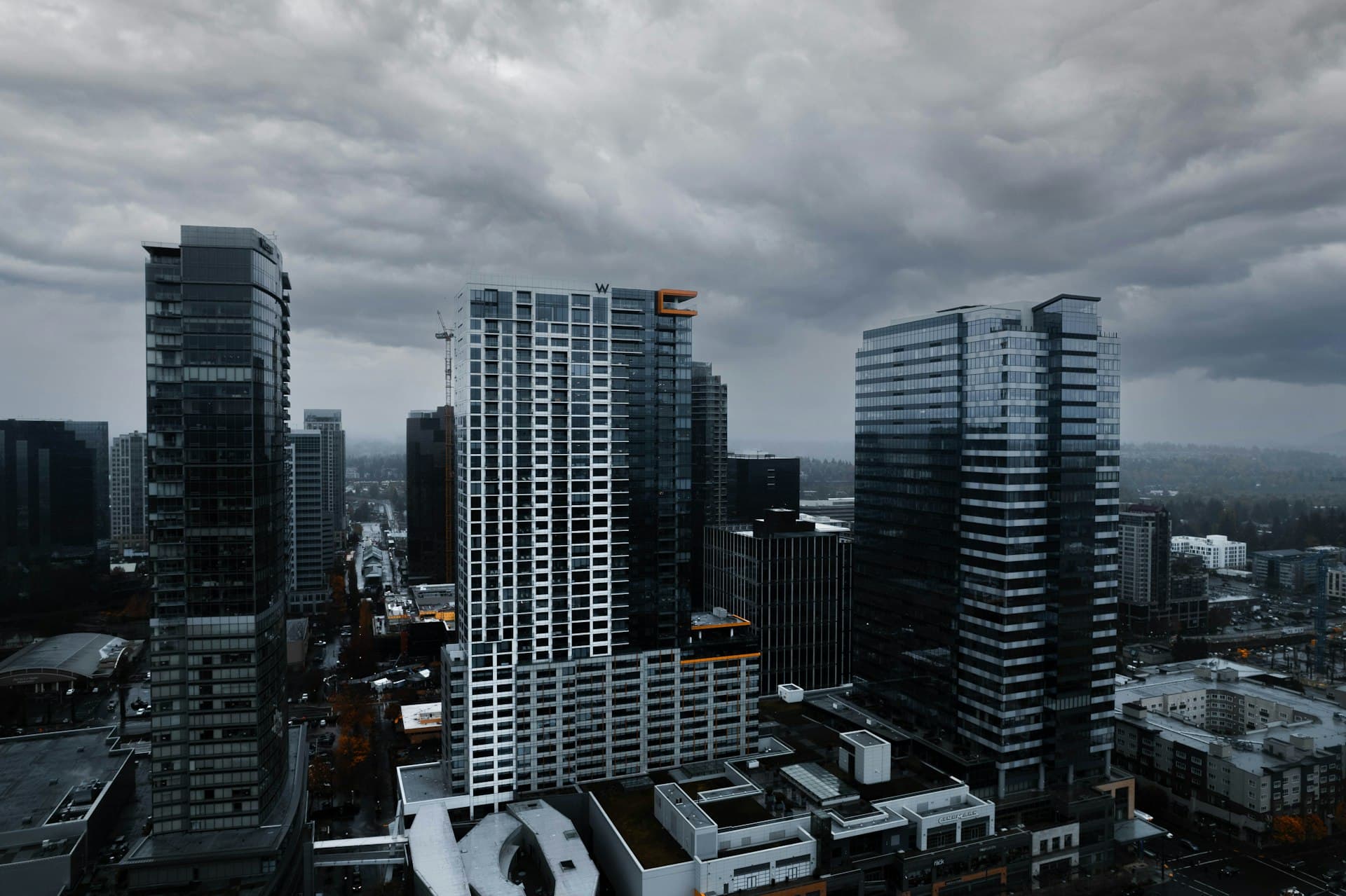 Aerial view of downtown Bellevue Washington with W Hotel and high-rise buildings under cloudy sky