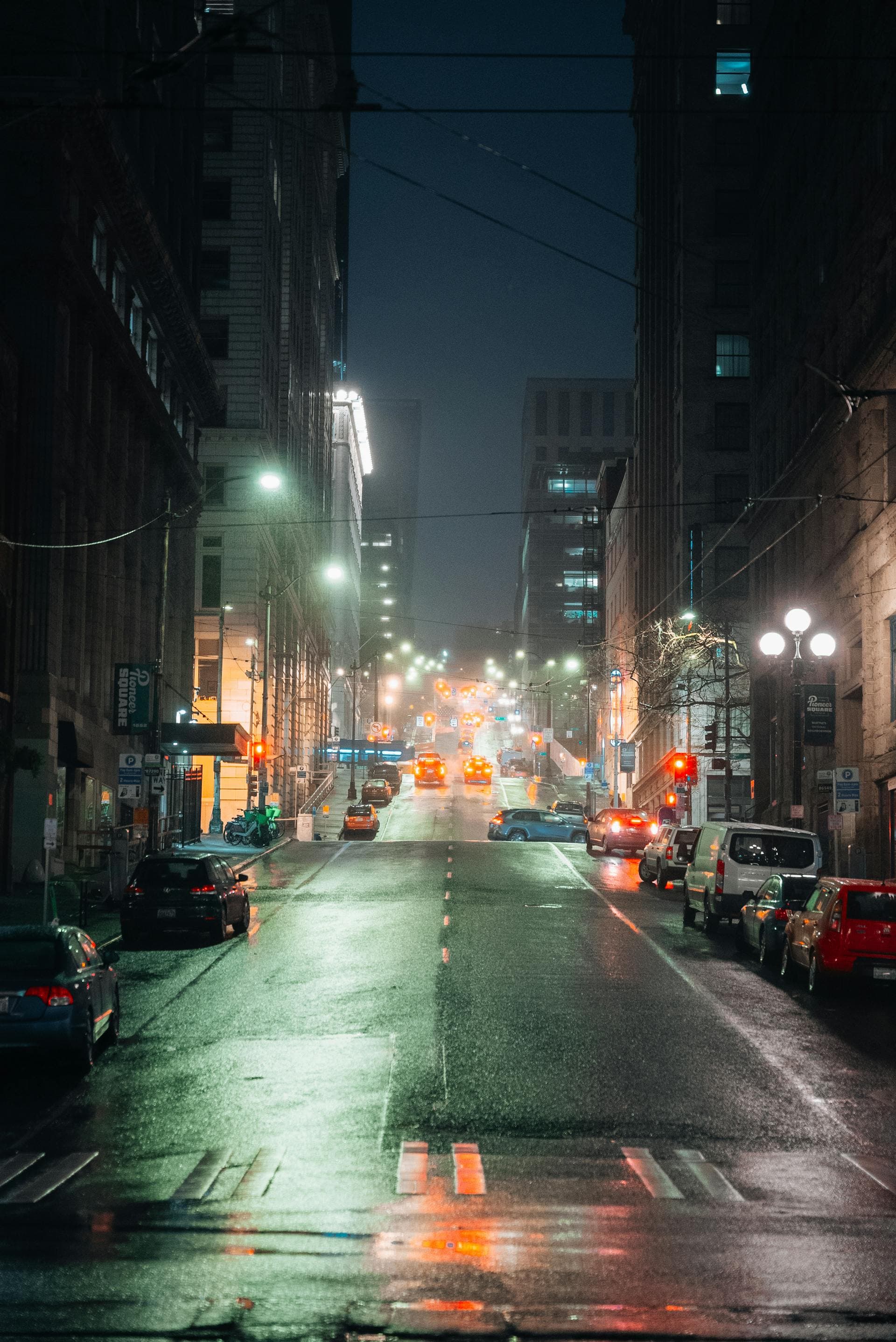 Rainy night street scene in downtown Seattle Washington showing wet Pacific Northwest weather