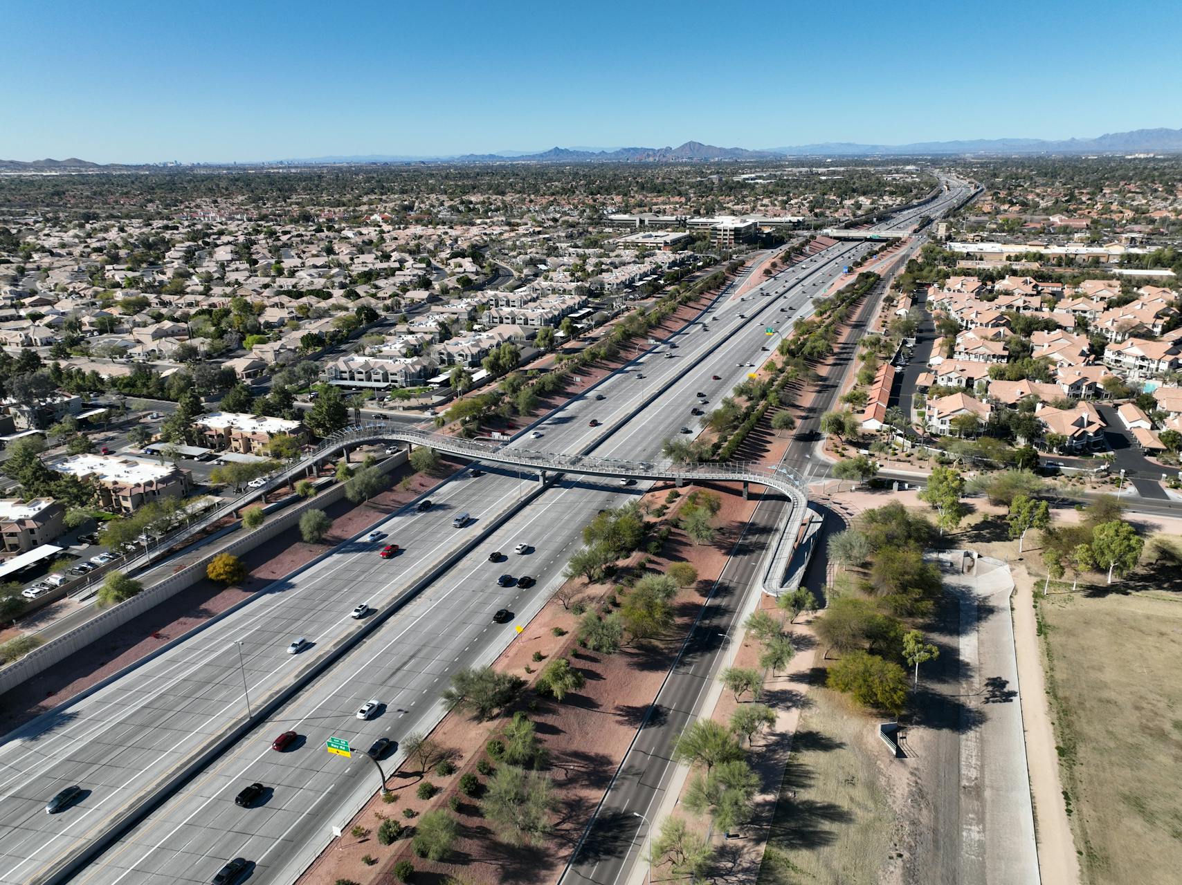 Aerial view of Chandler Arizona showing highway, residential neighborhoods, and clear desert sky