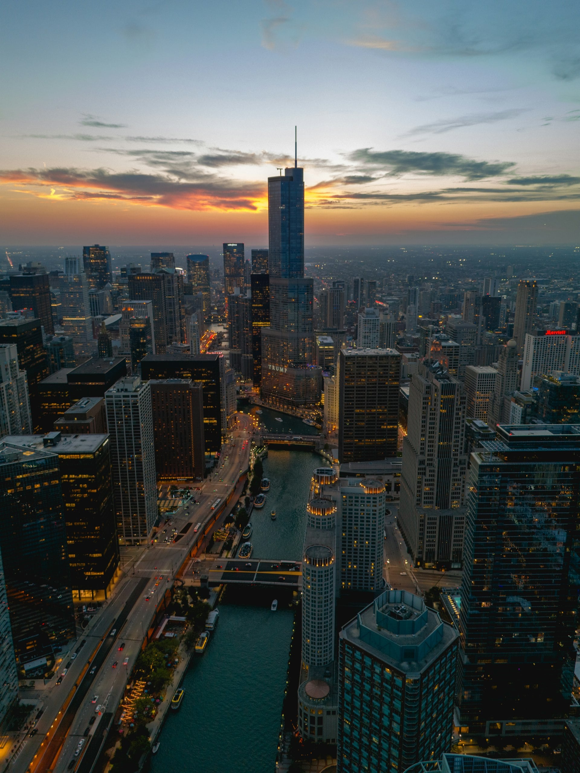 Aerial view of Chicago skyline at sunset with Chicago River and downtown skyscrapers
