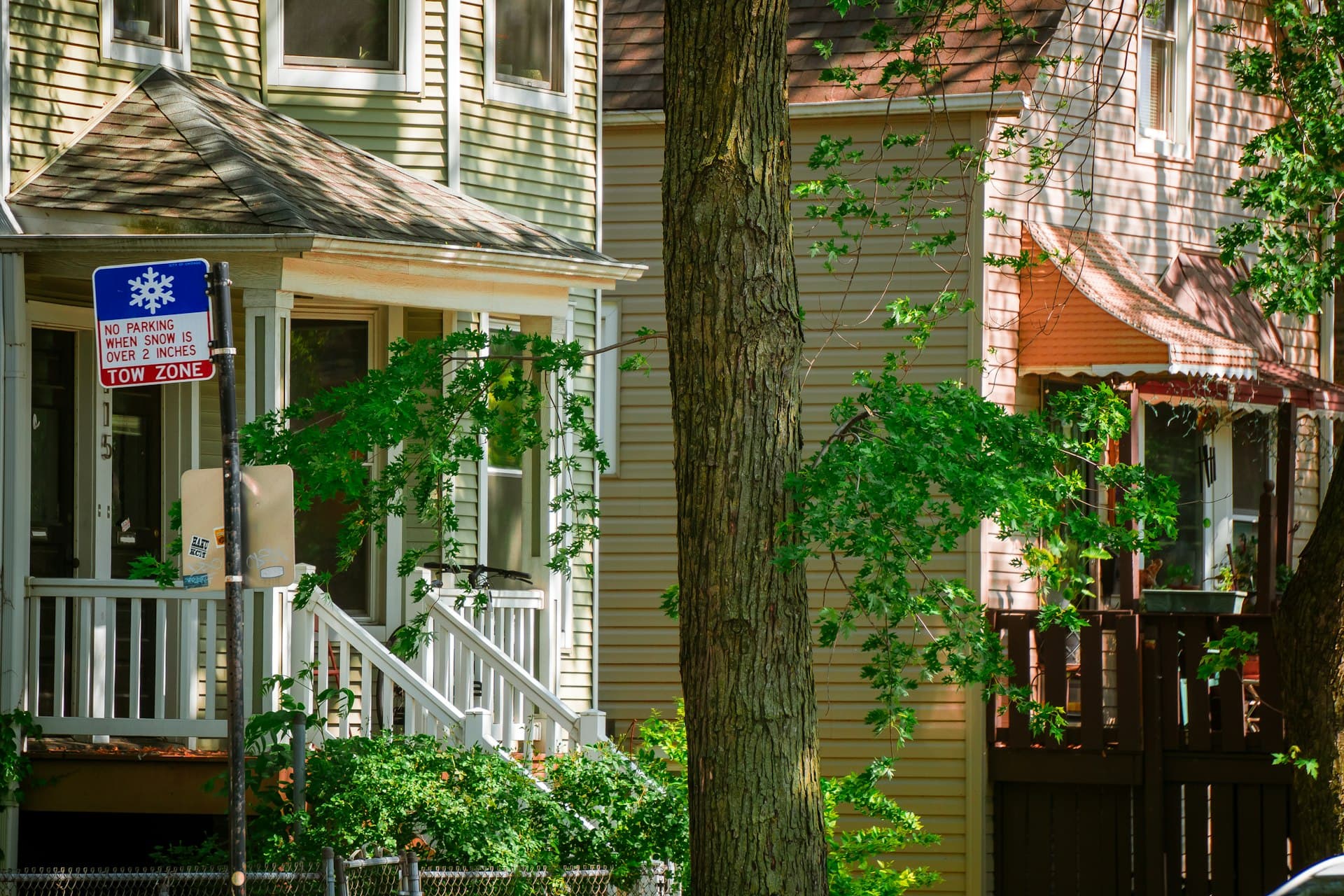 Residential homes with porches and rooflines in Logan Square Chicago neighborhood