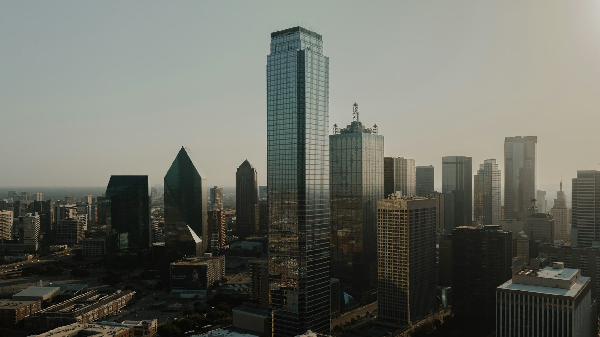 Dallas Texas downtown skyline with glass skyscrapers at sunrise
