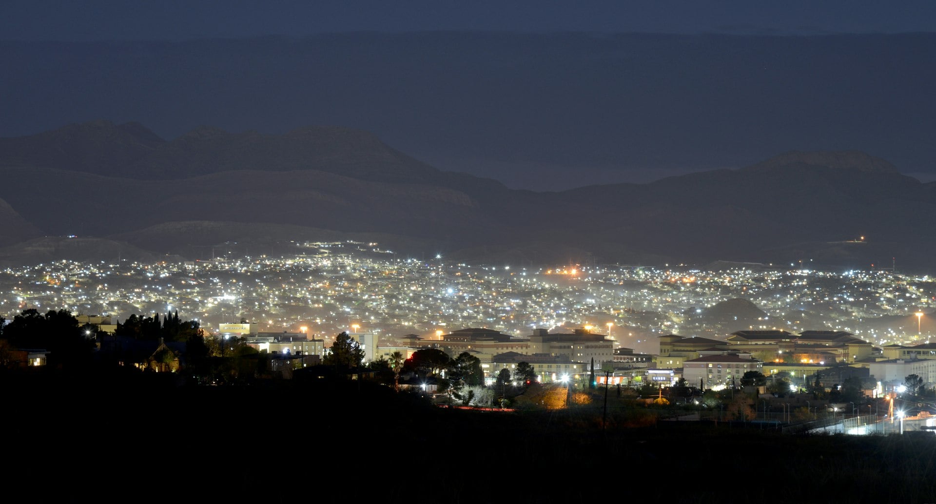 Night view of El Paso Texas and Juarez Mexico from Franklin Mountains showing city lights