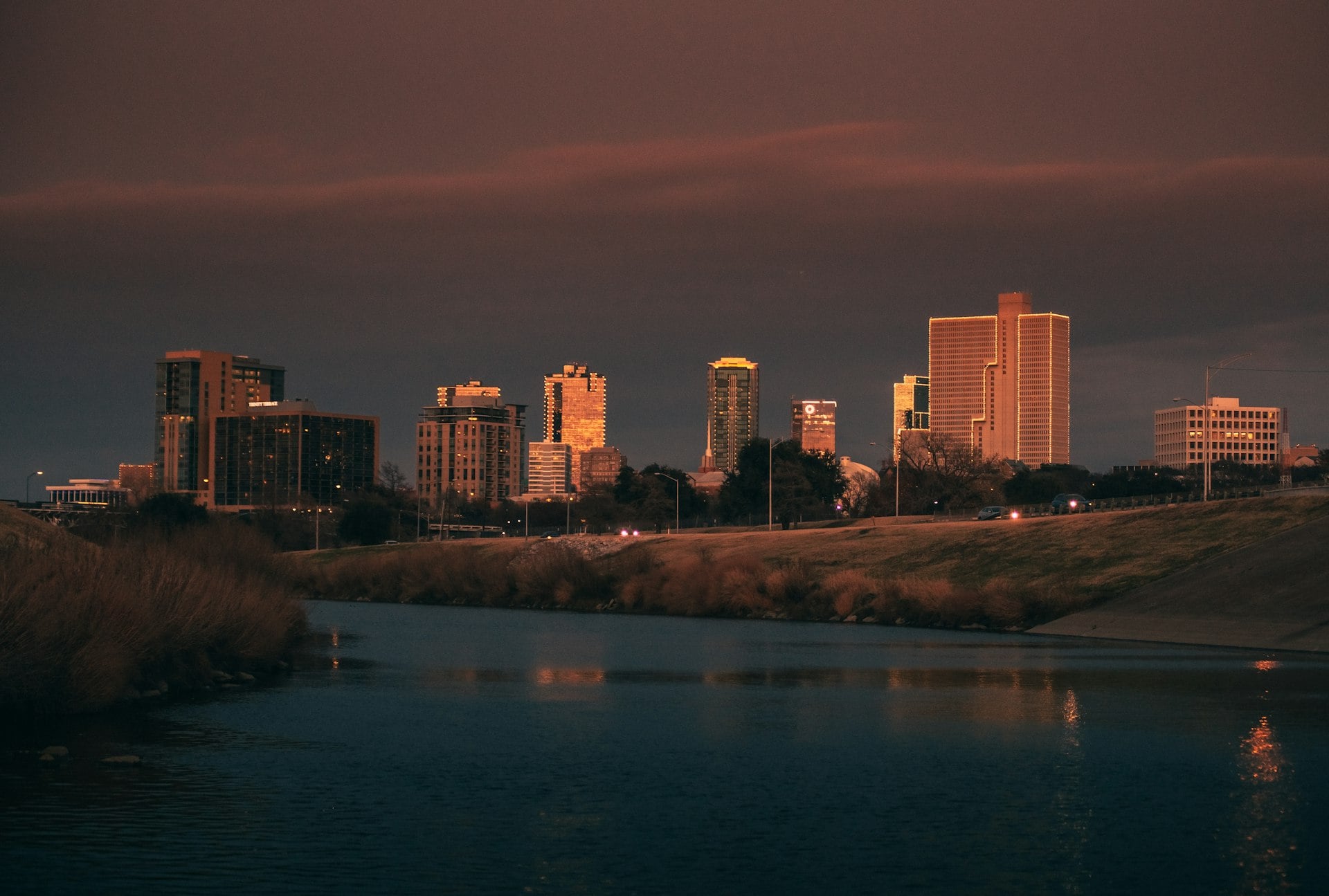 Fort Worth Texas downtown skyline at dusk with Trinity River reflection