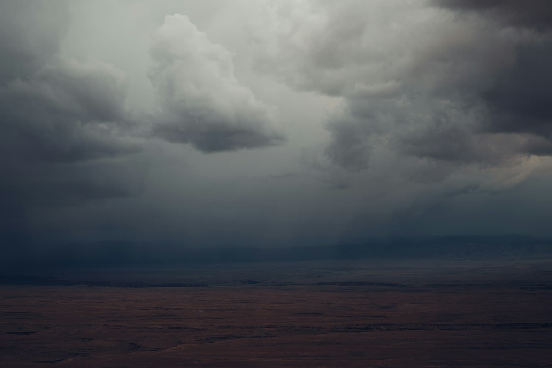 Dark monsoon storm clouds gathering over Arizona desert landscape