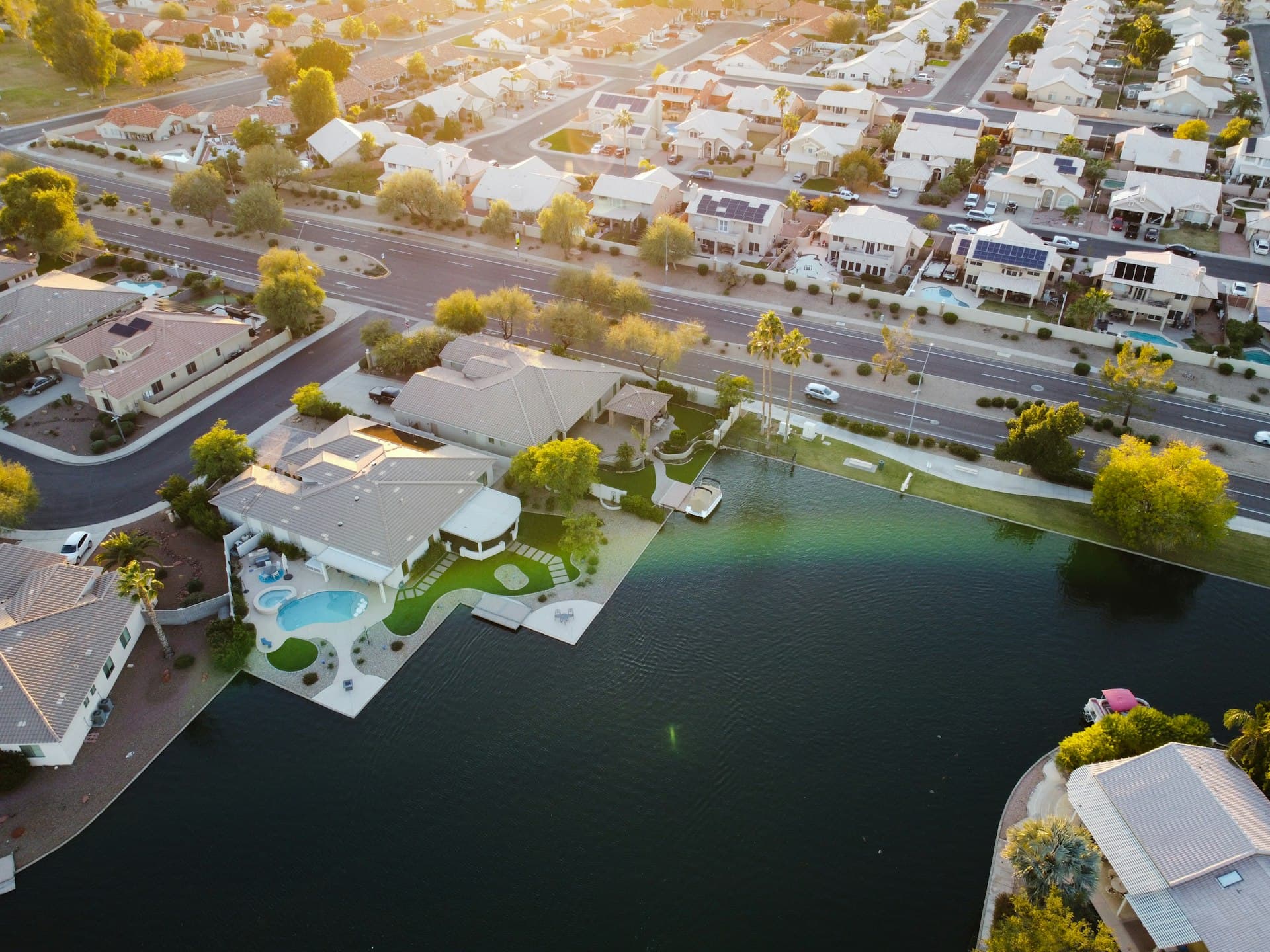 Aerial view of lakefront homes with pools in Peoria Arizona near Arrowhead Ranch