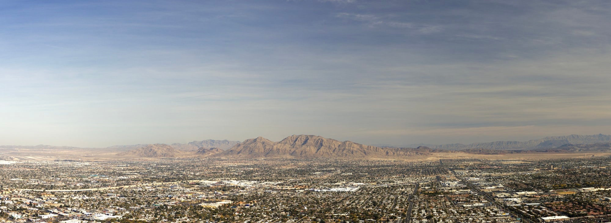 Panoramic aerial view of Las Vegas Valley with mountains in the background