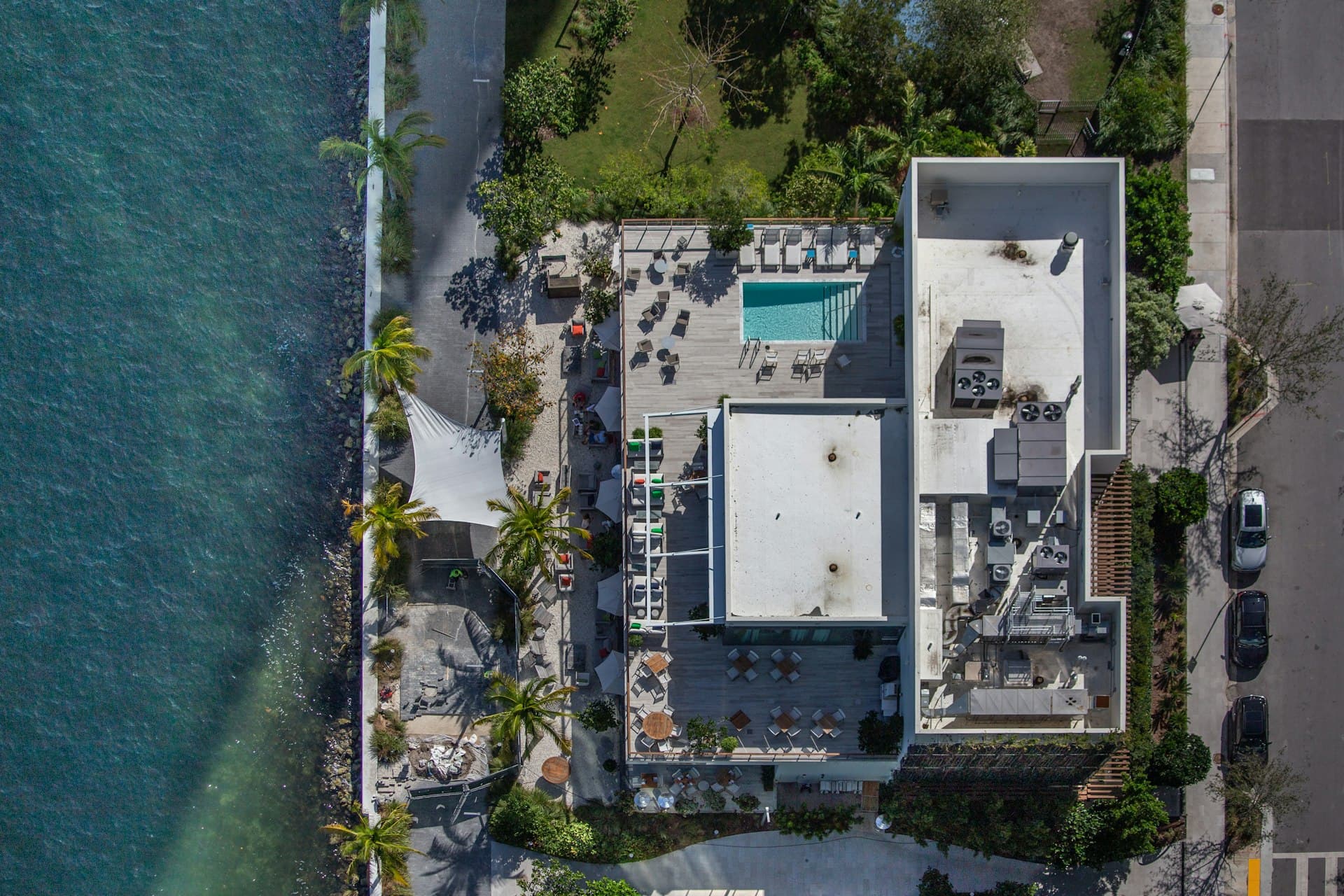 Aerial view of Miami waterfront property showing flat roof systems typical of South Florida