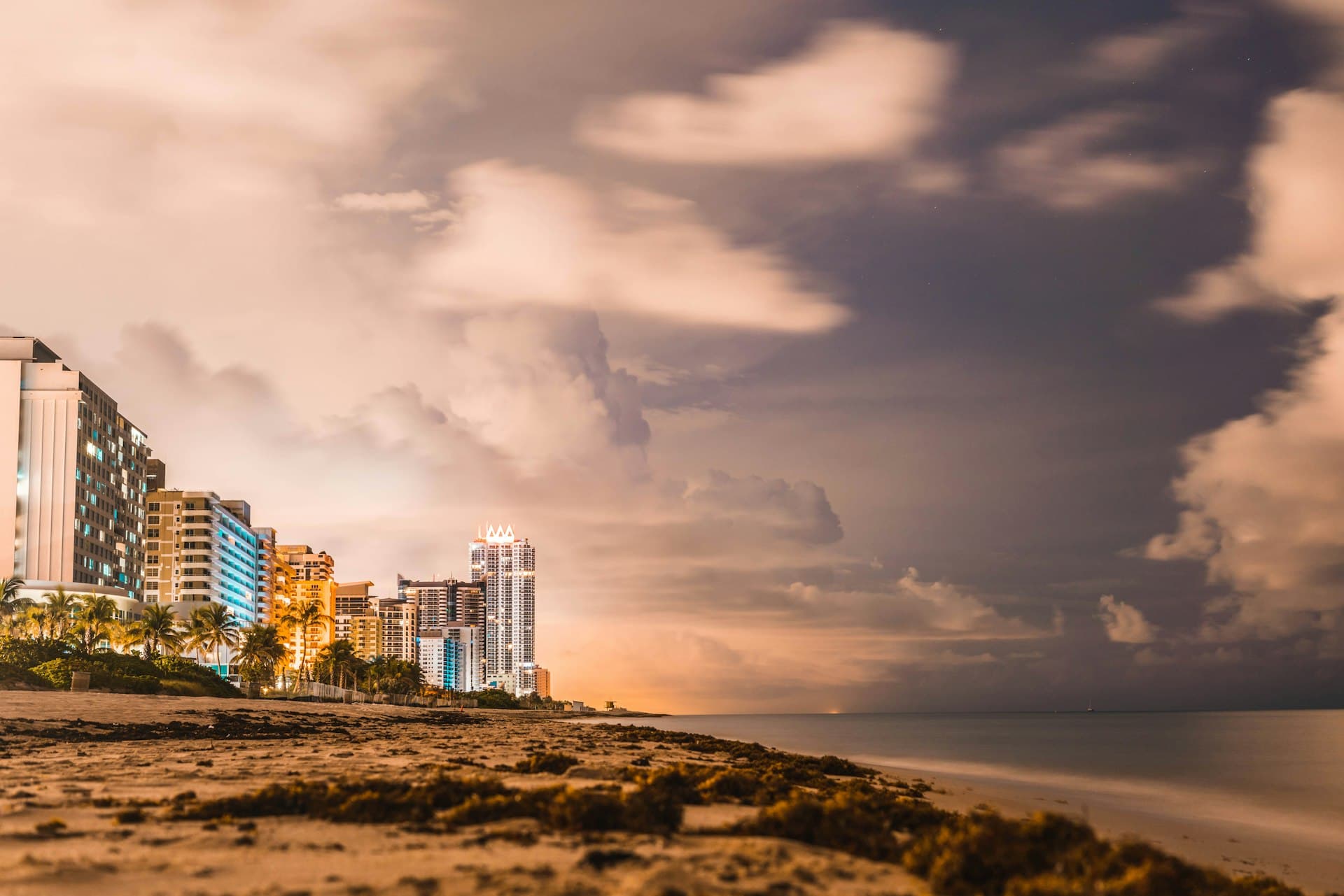 Miami Beach skyline with dramatic storm clouds approaching at sunset