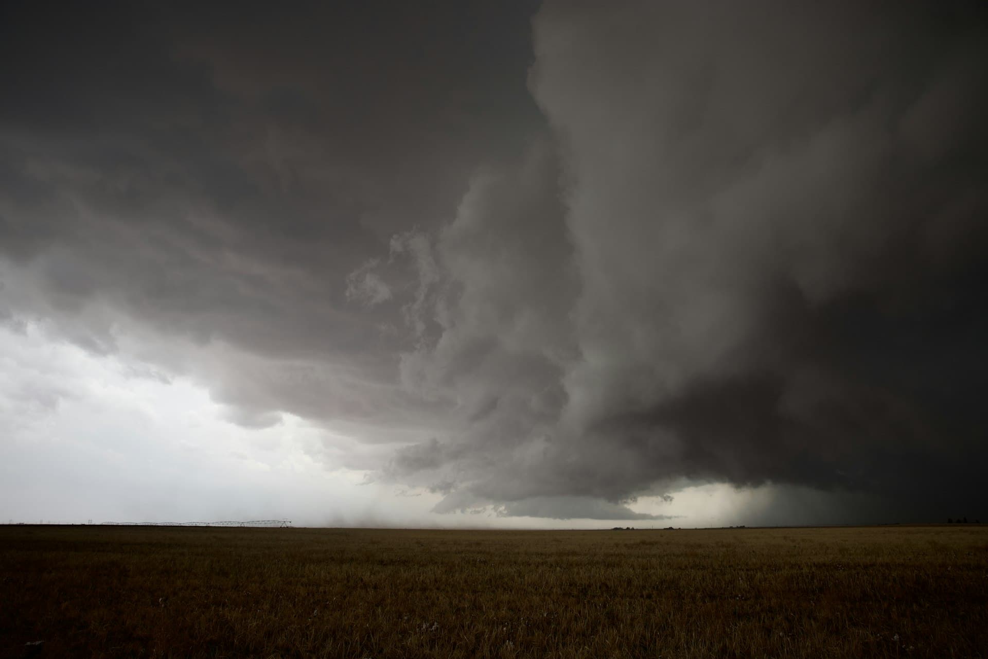 Dark storm clouds rolling over Texas field showing severe weather threat