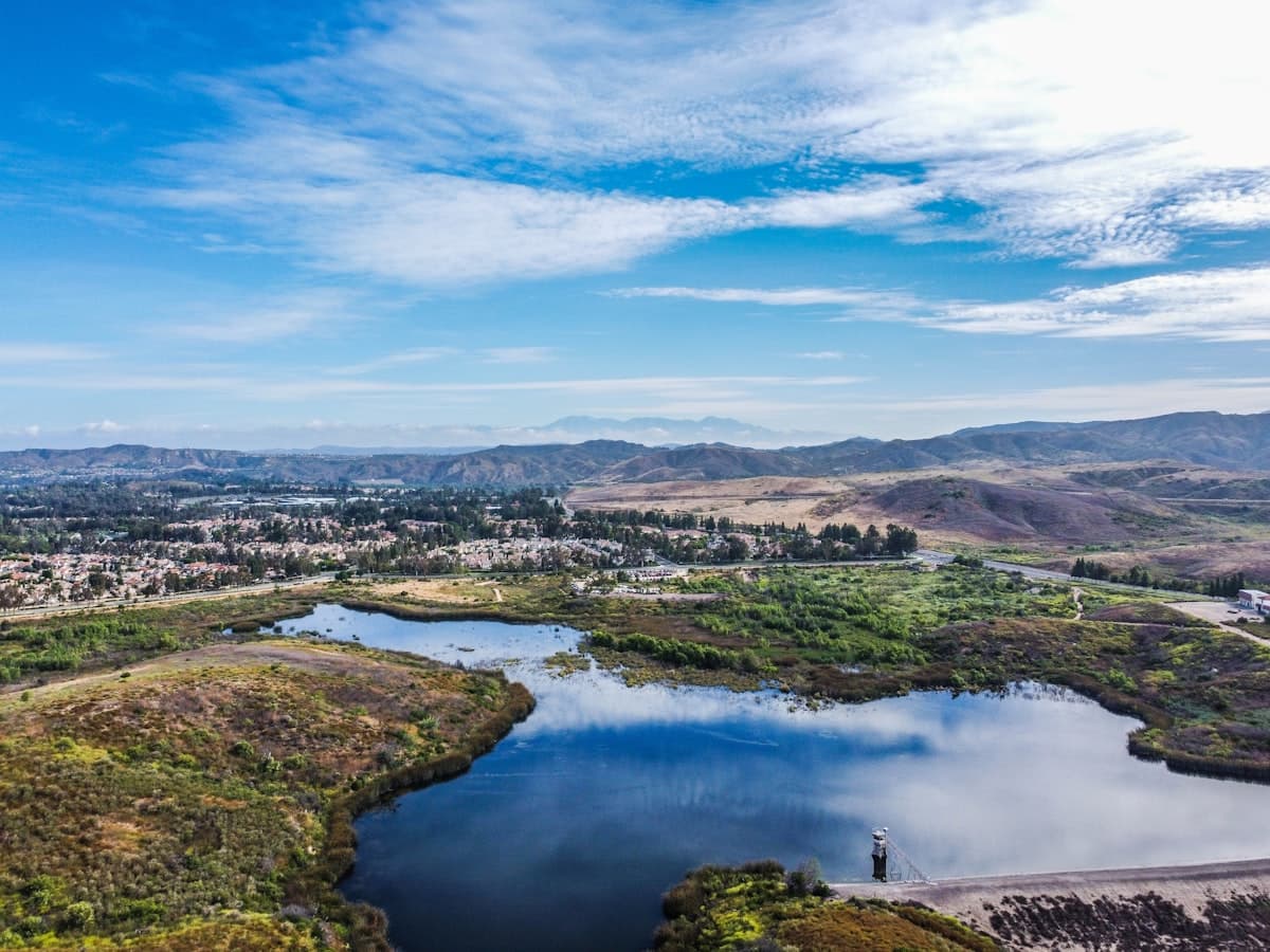 Aerial view of Irvine California showing lakes, residential communities and hills