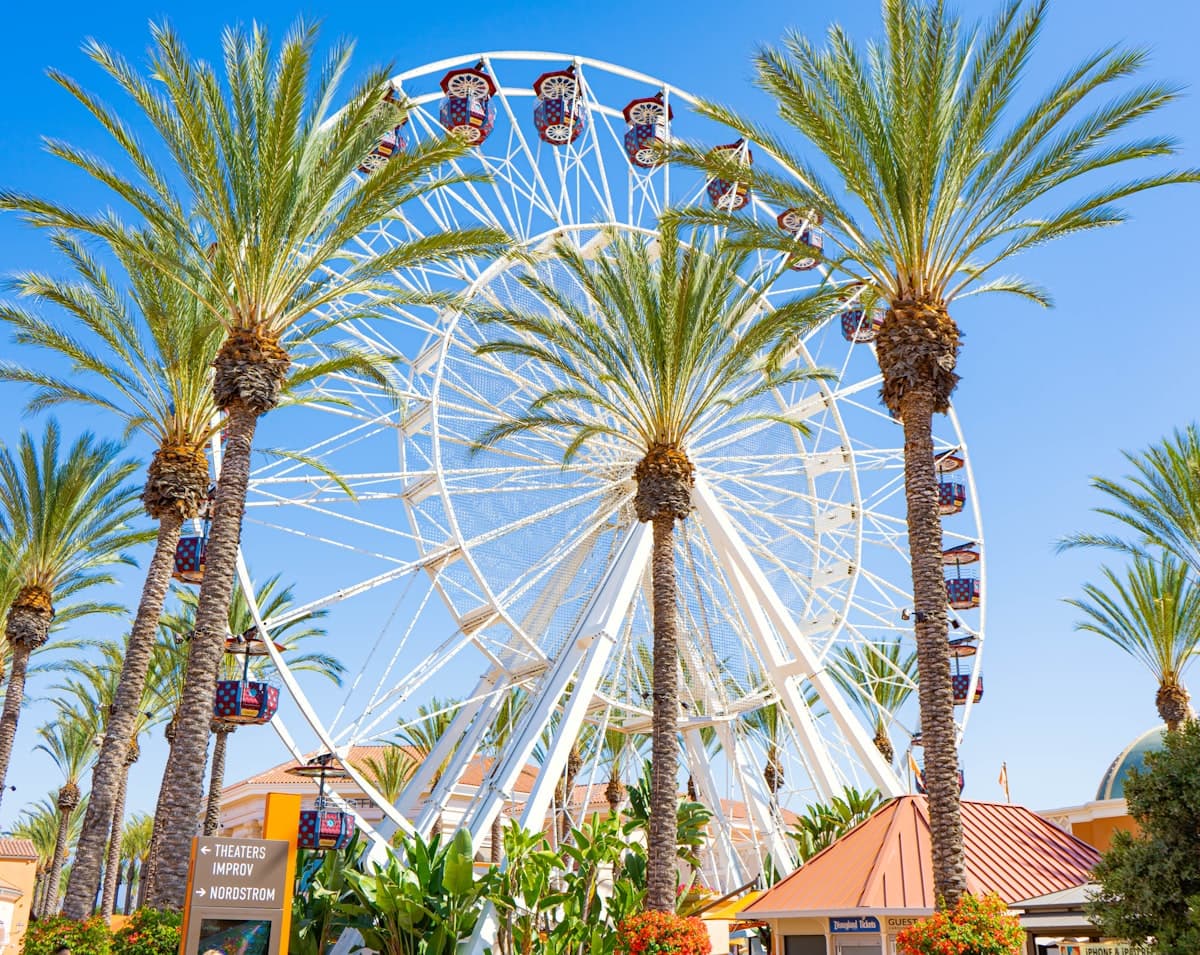 Irvine Spectrum Center giant wheel with palm trees and retail signage