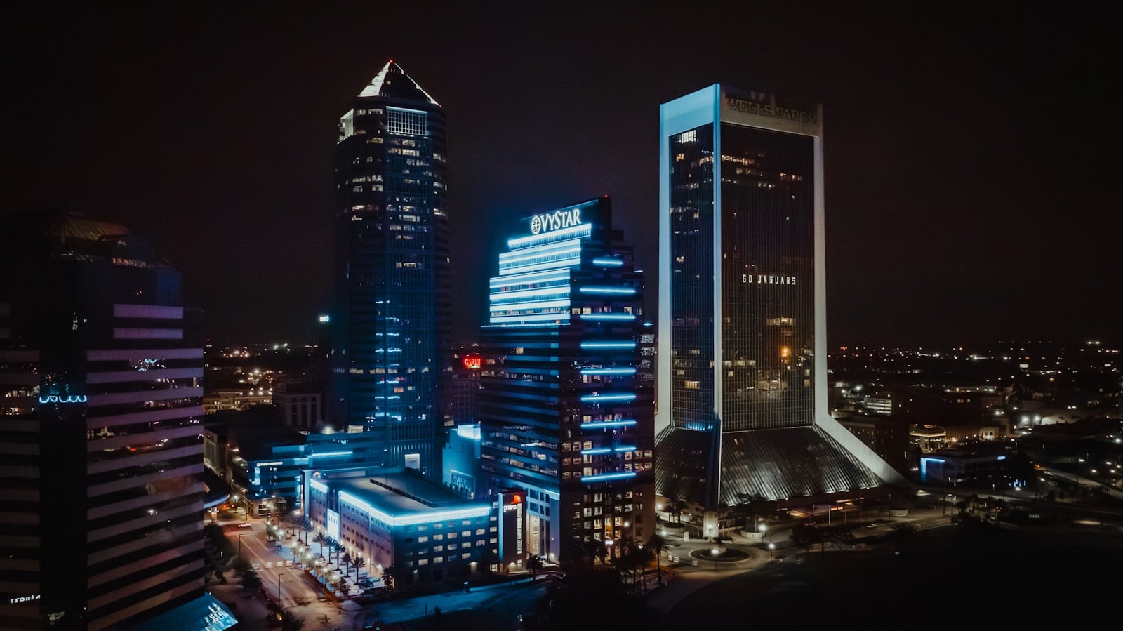 Jacksonville Florida downtown skyline at night featuring VyStar Tower and Wells Fargo building