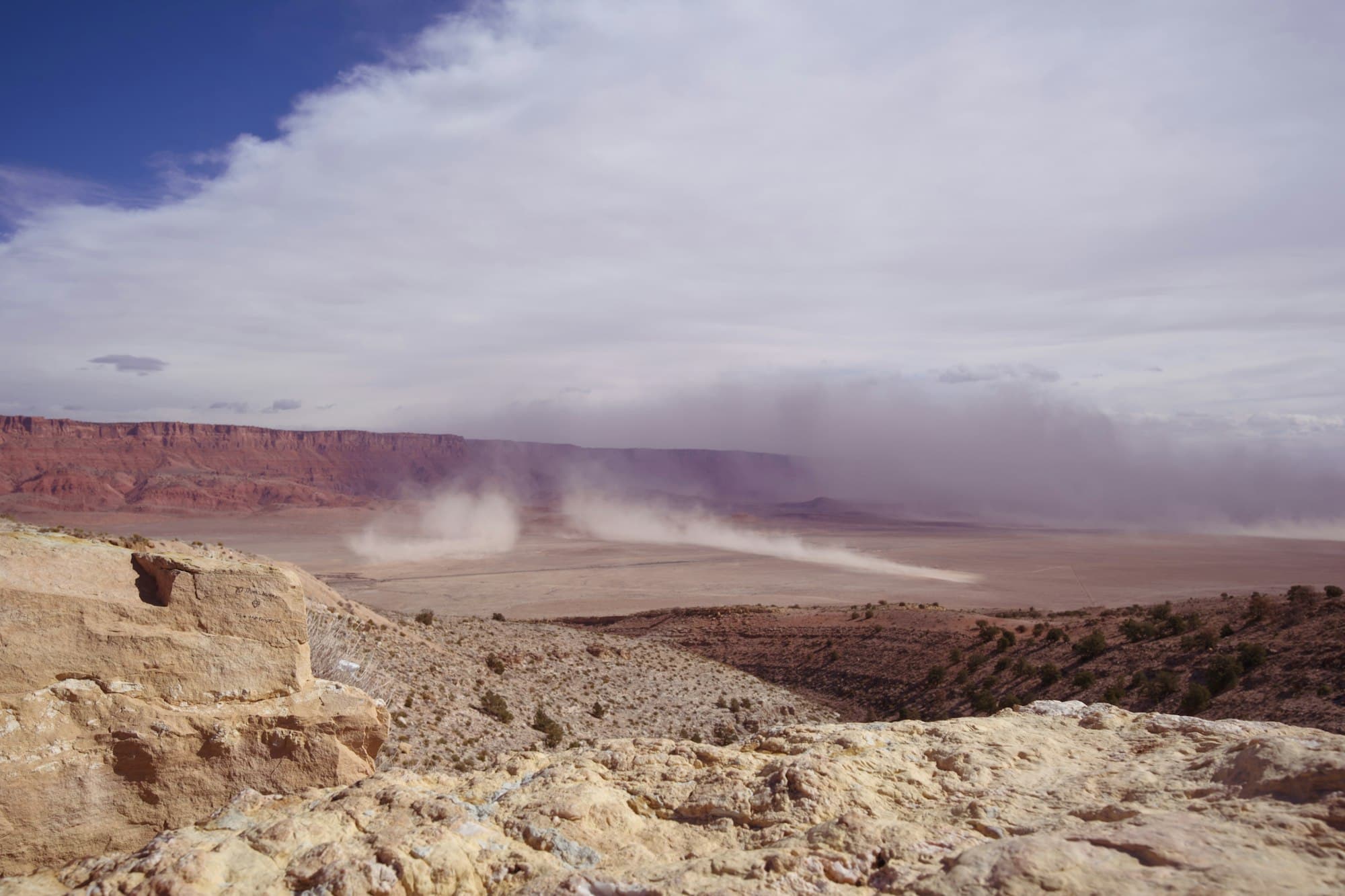 Desert dust storm approaching across southwestern landscape
