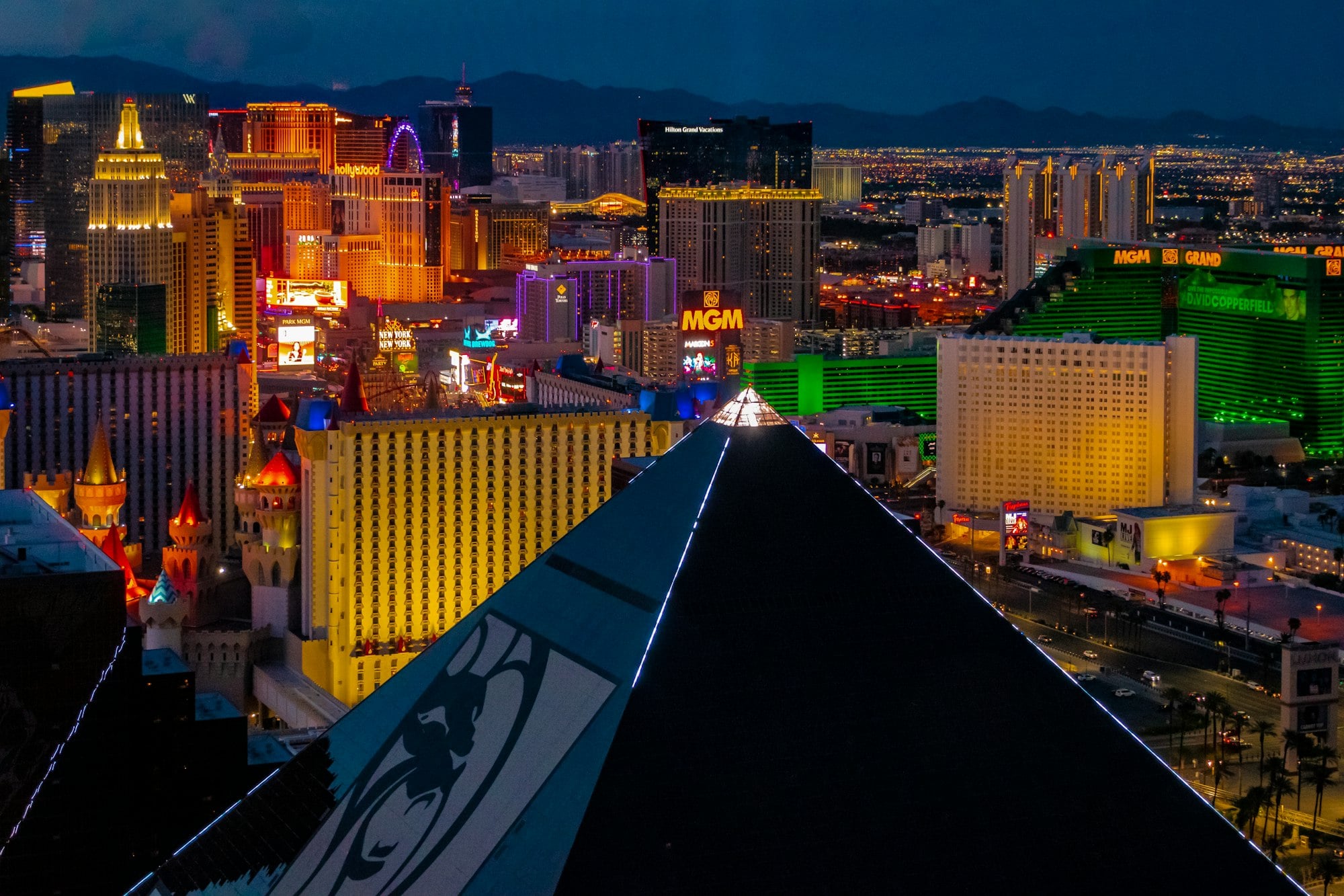 Las Vegas Strip skyline at night with Luxor pyramid and iconic casinos