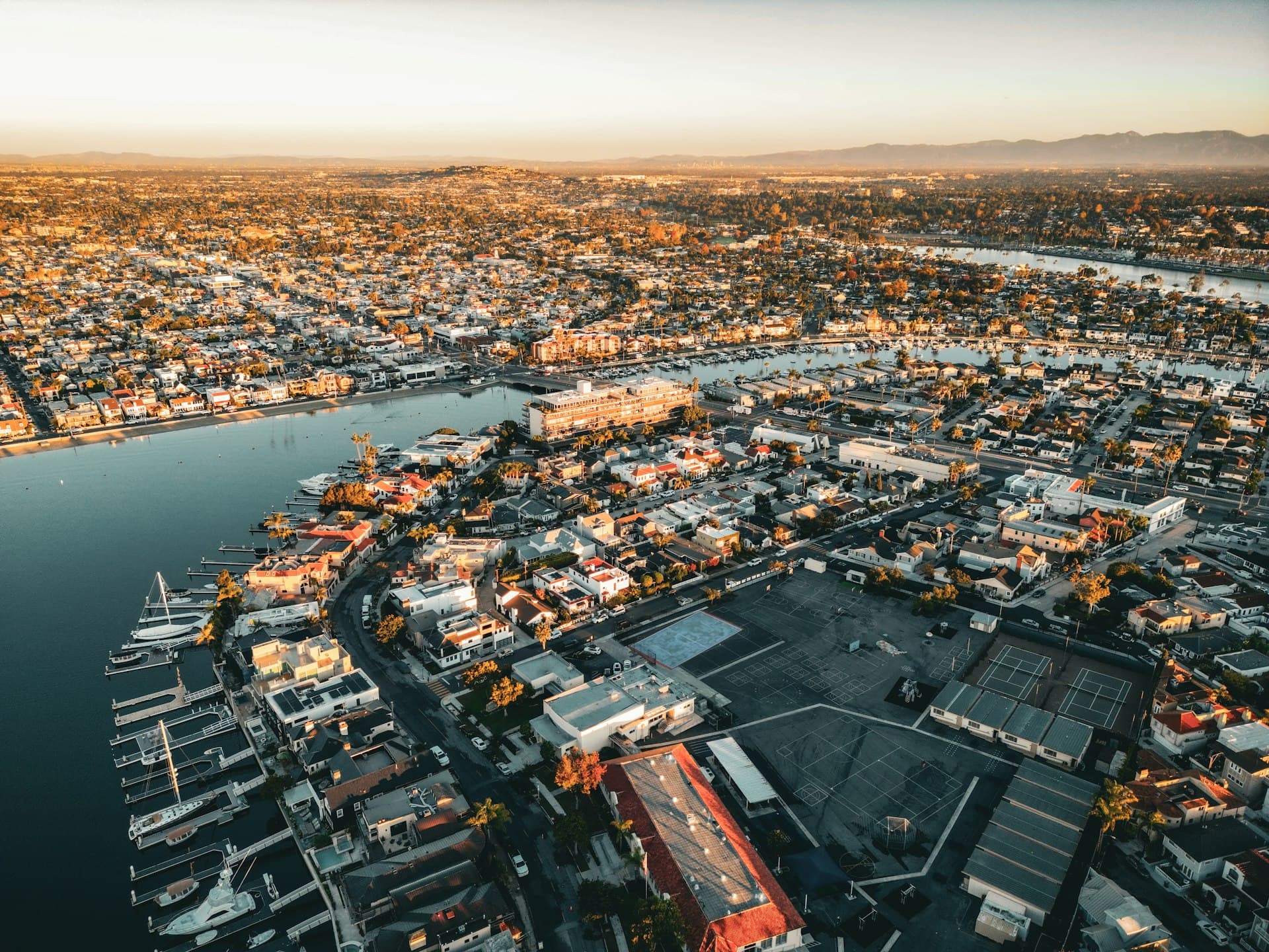 Aerial view of Naples Island Long Beach California waterfront homes at sunset