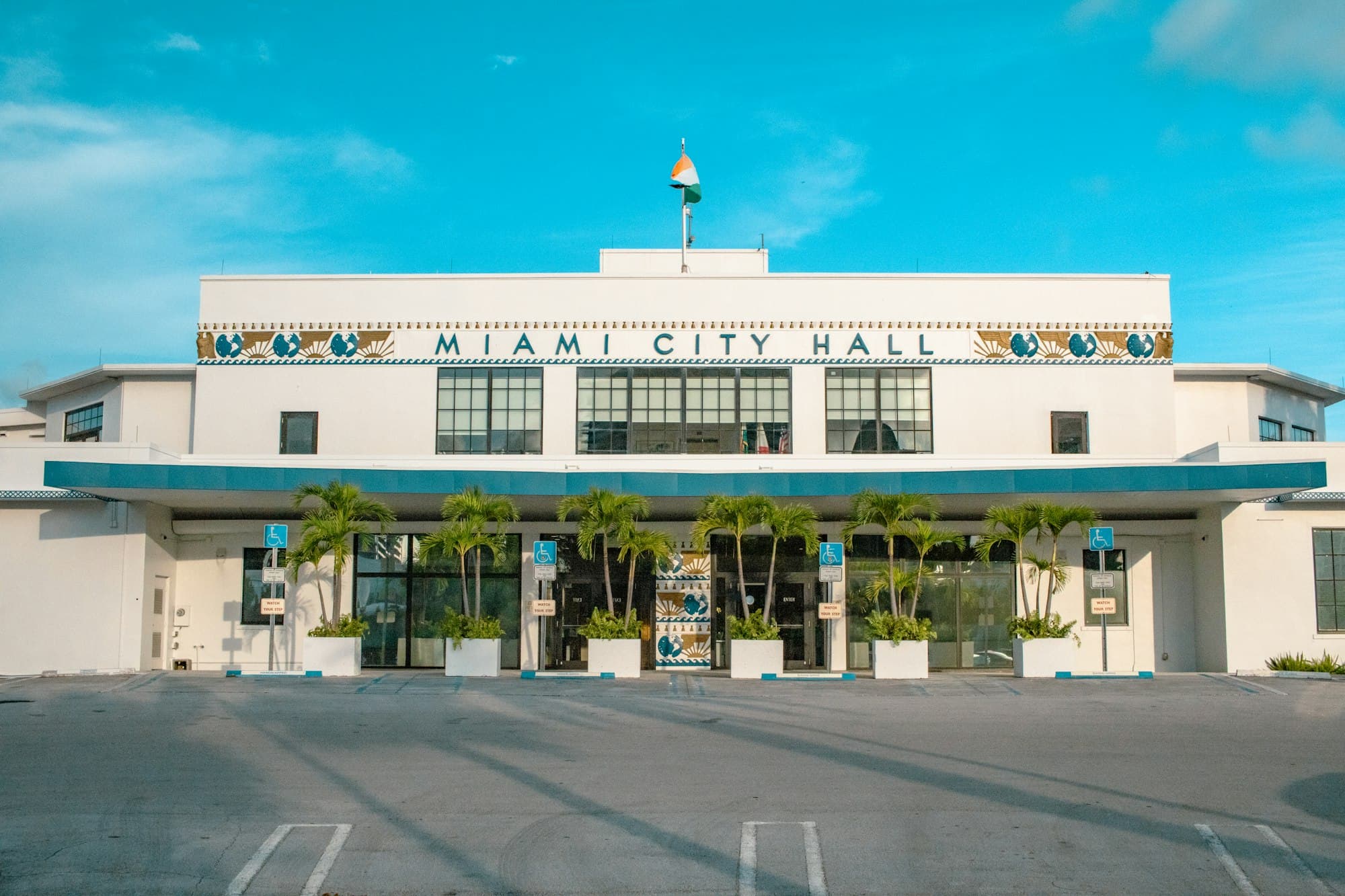 Miami City Hall historic Art Deco building with palm trees in Coconut Grove