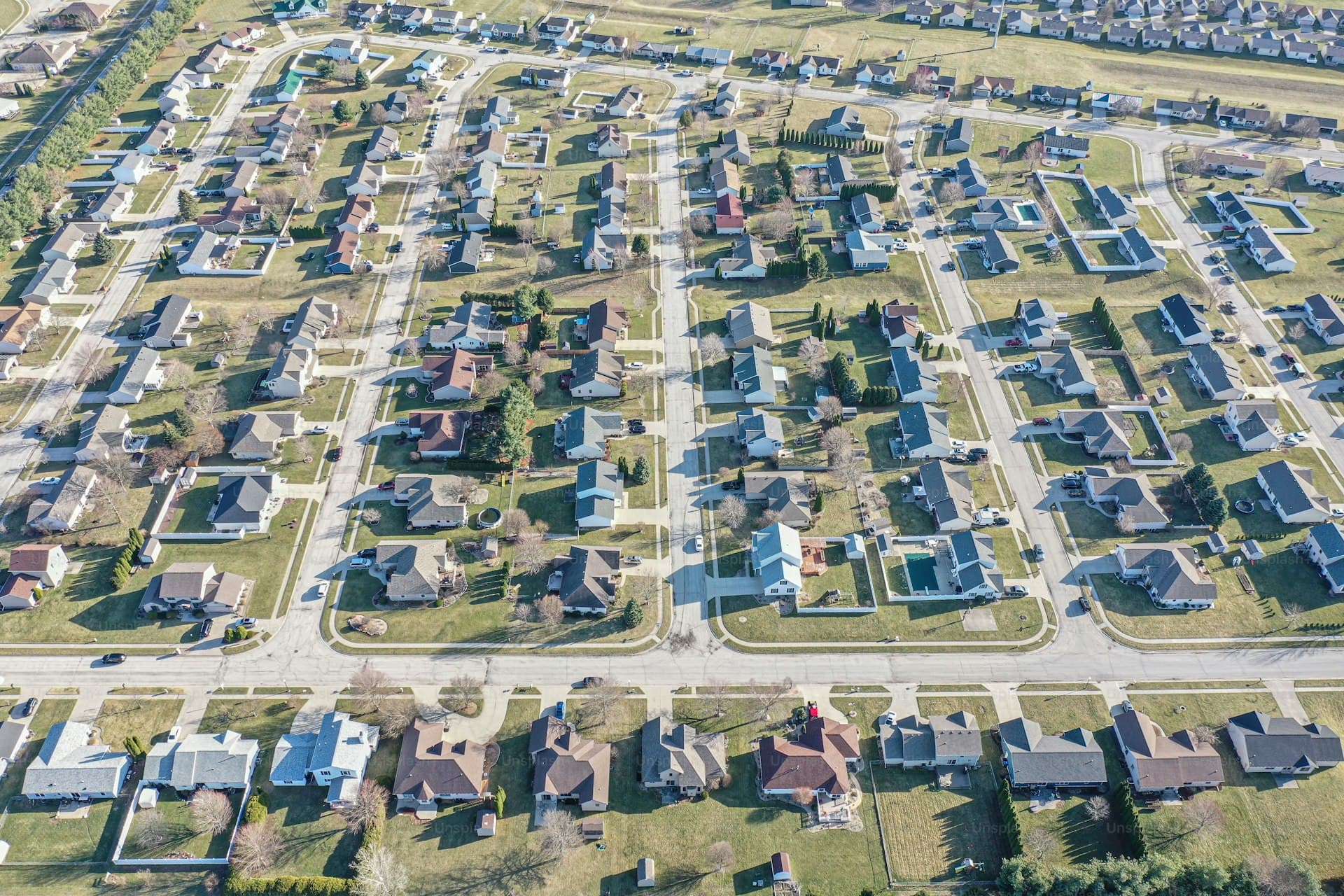 Aerial view of Illinois residential neighborhood showing suburban layout and roof styles
