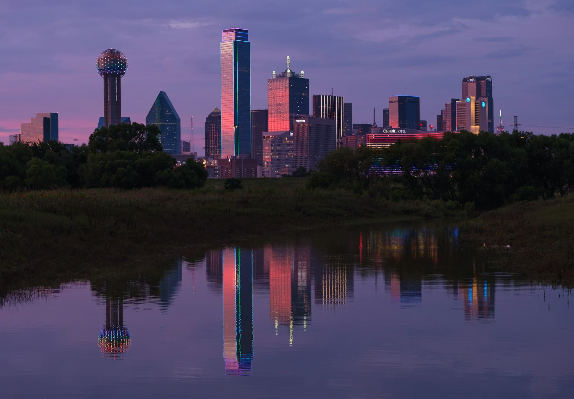 Dallas-Fort Worth metroplex skyline at sunset reflected in Trinity River