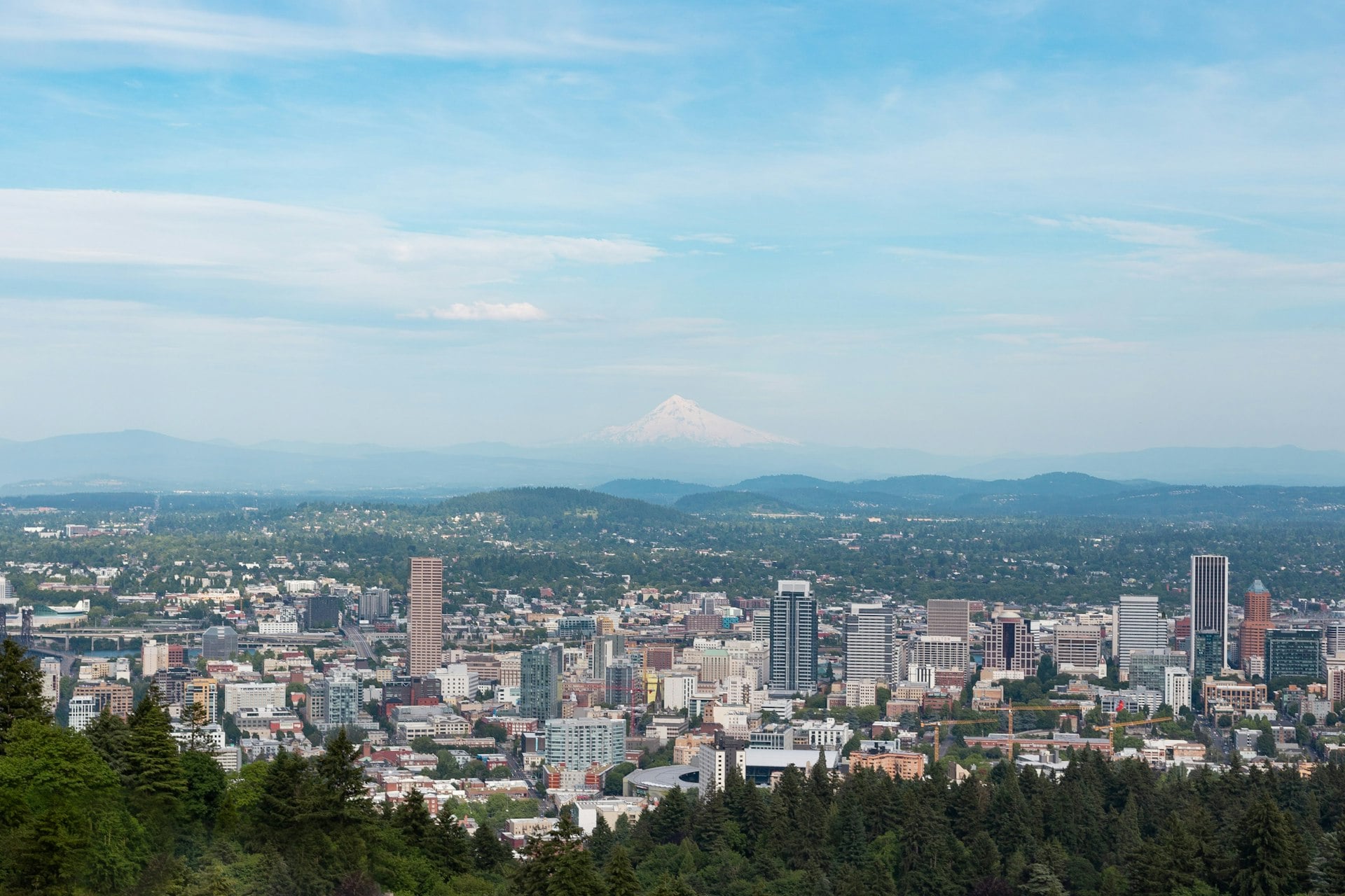 Portland Oregon skyline with Mount Hood in background and downtown buildings
