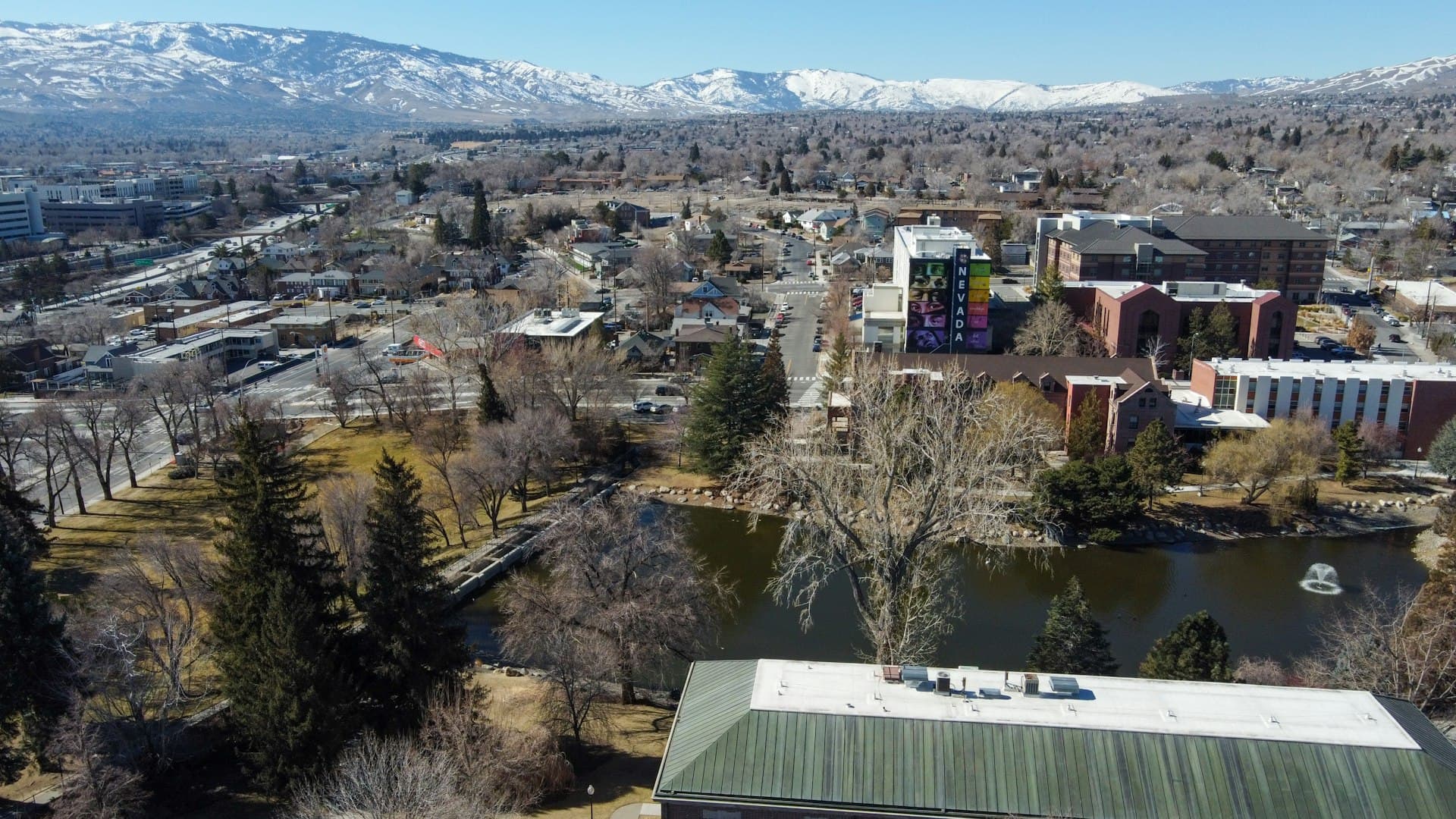 Aerial view of Reno Nevada with snow-capped Sierra Nevada mountains in the background