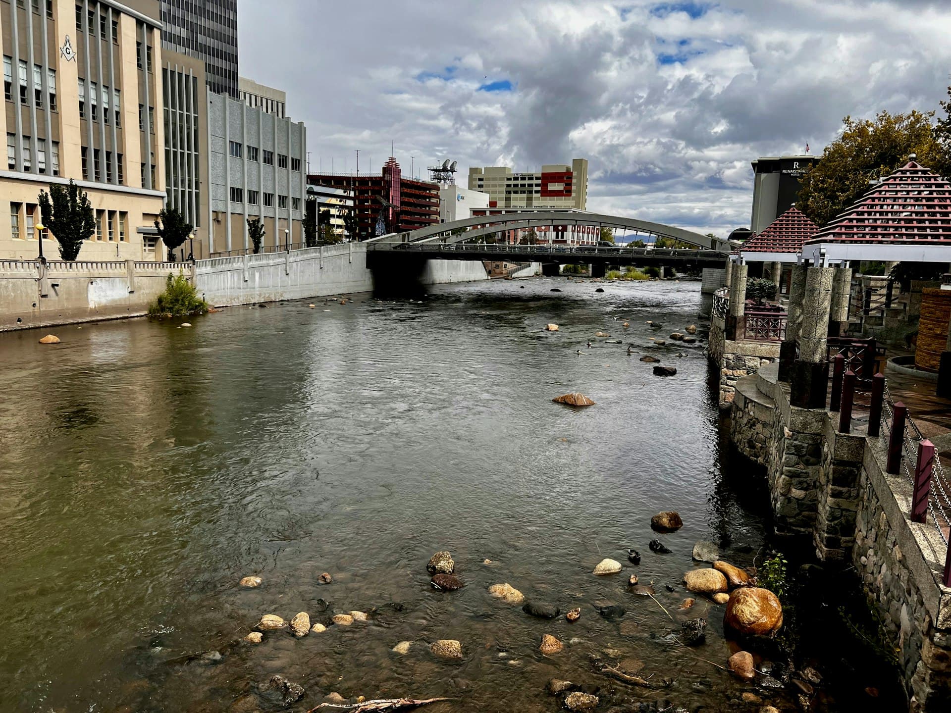 Truckee River flowing through downtown Reno Nevada with bridge and city buildings