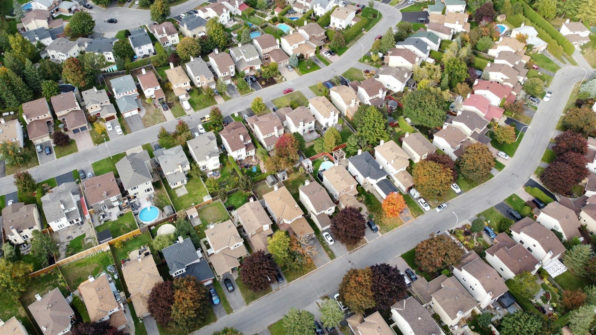 Aerial view of suburban neighborhood showing residential rooftops
