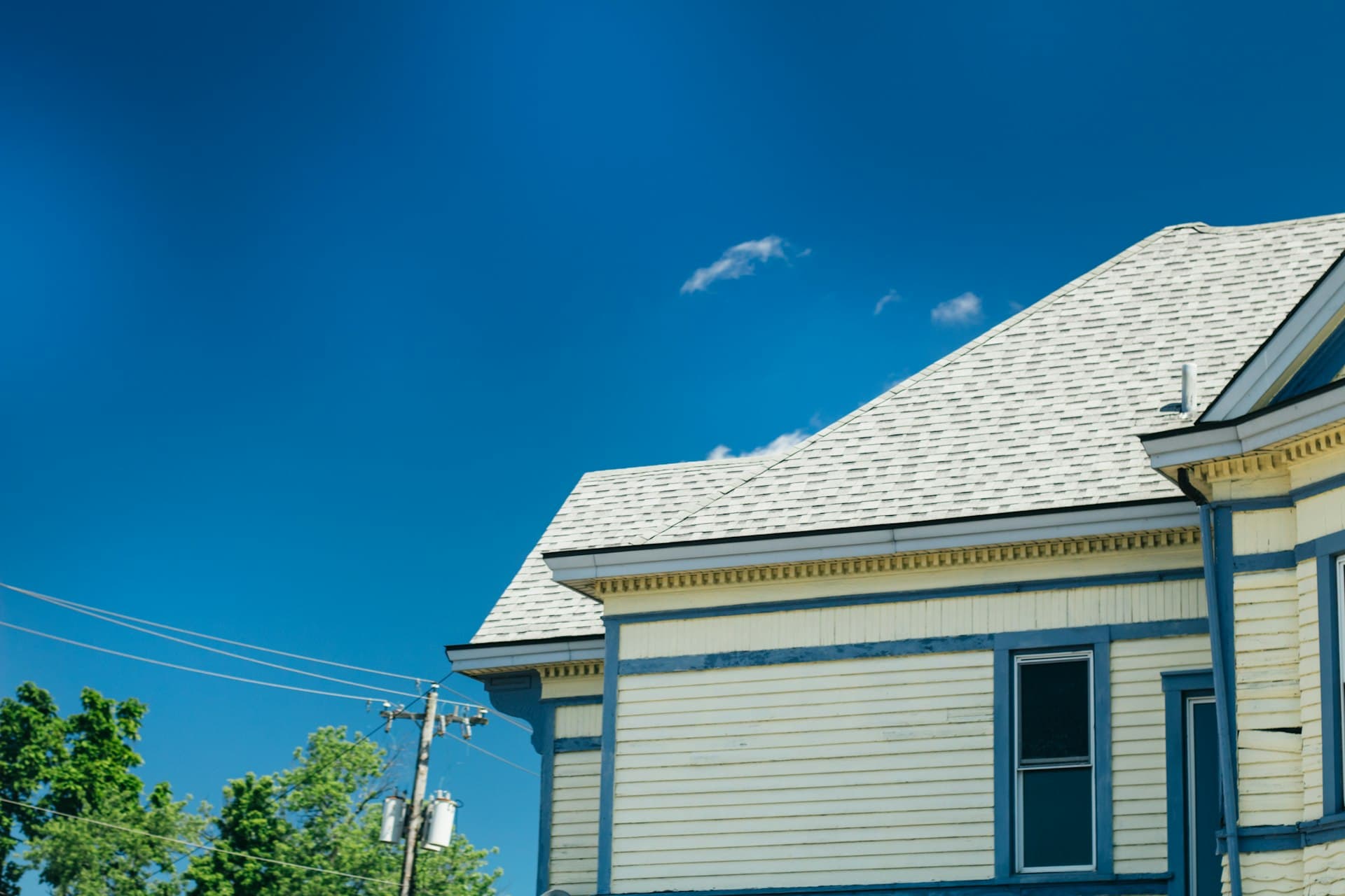 Historic Midwest Victorian home with visible shingle roof