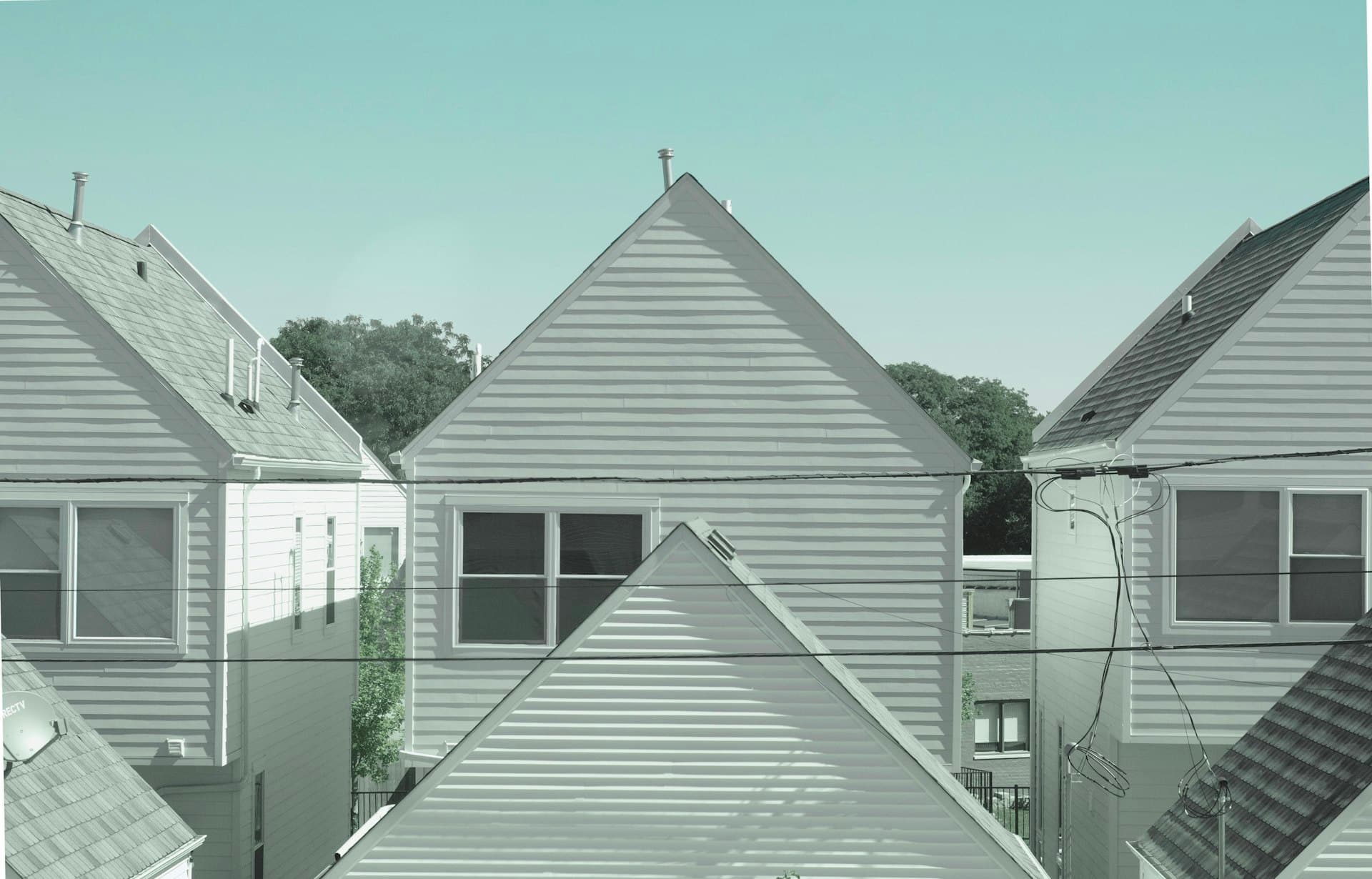 Midwest suburban homes with steep-pitched roofs typical of Northern Illinois