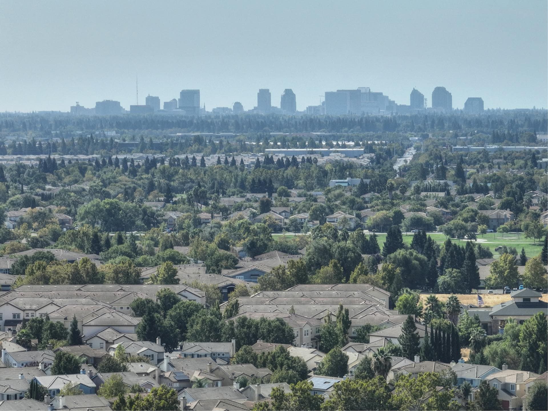 Sacramento suburban homes with downtown skyline in the distance