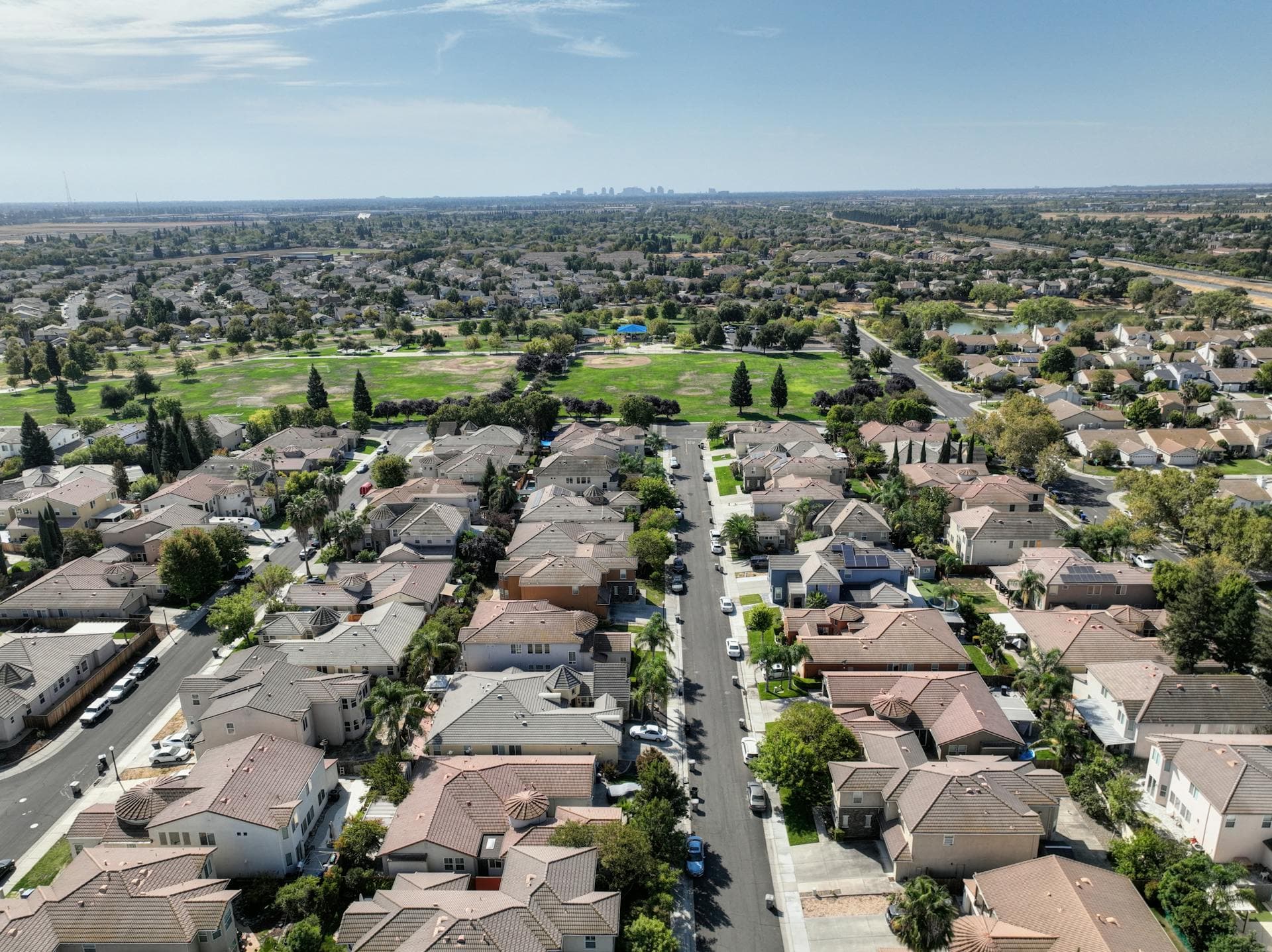 Aerial view of Sacramento suburban neighborhood with tile roofs