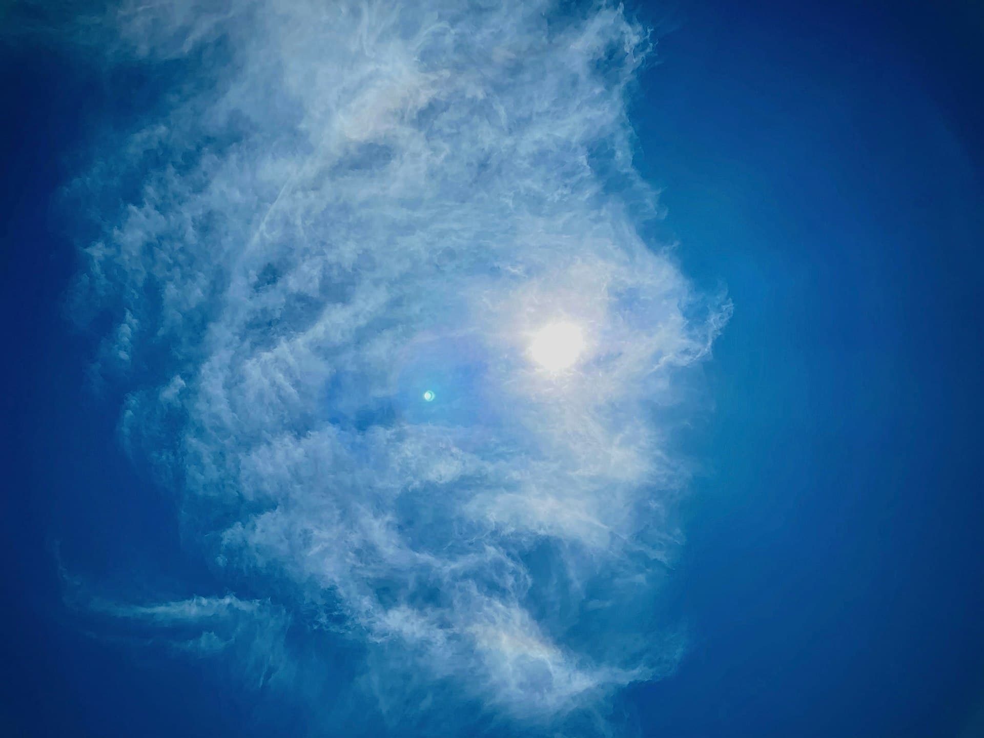 California blue sky with sun and white clouds representing Mediterranean climate