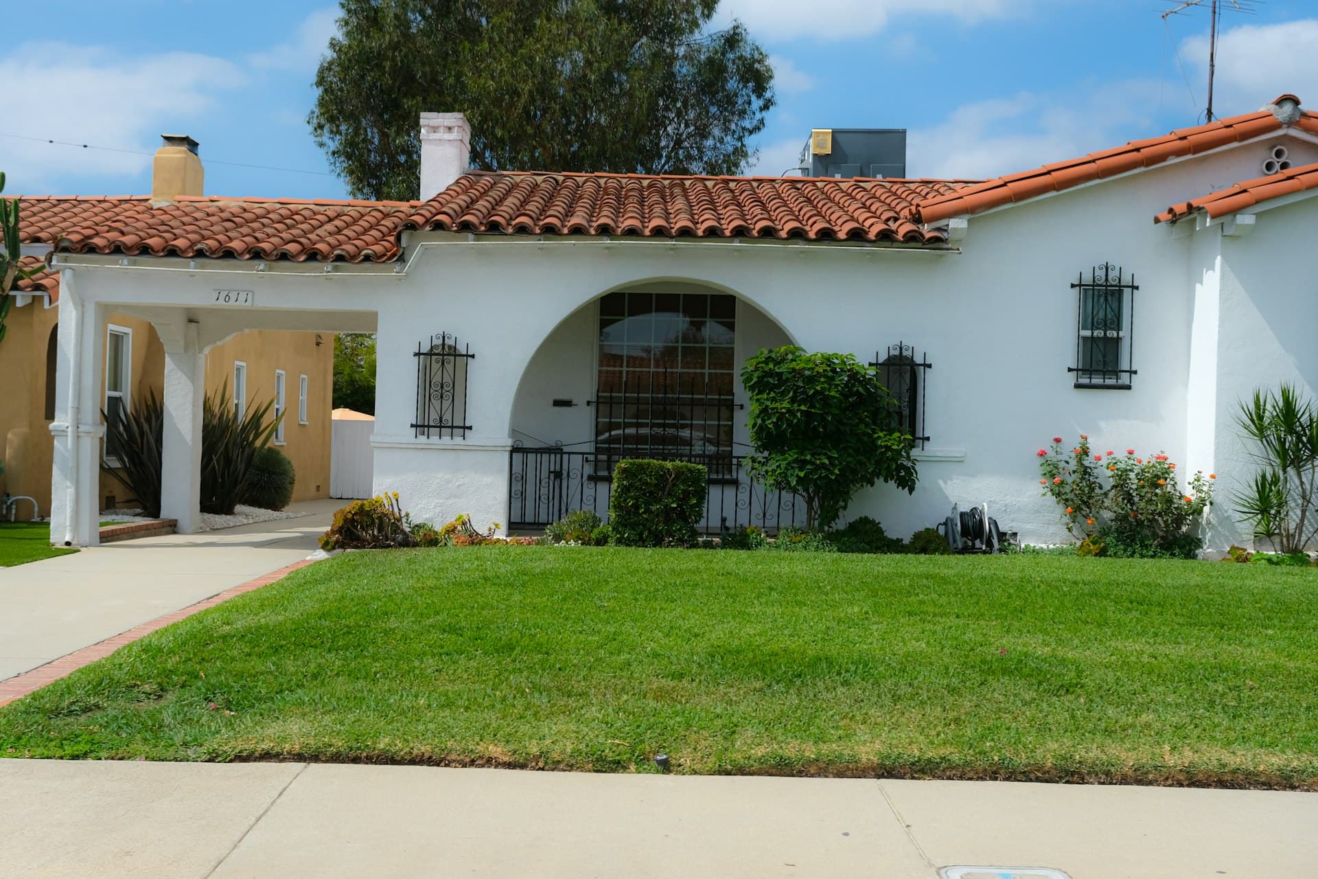 California Spanish-style home with red clay tile roof