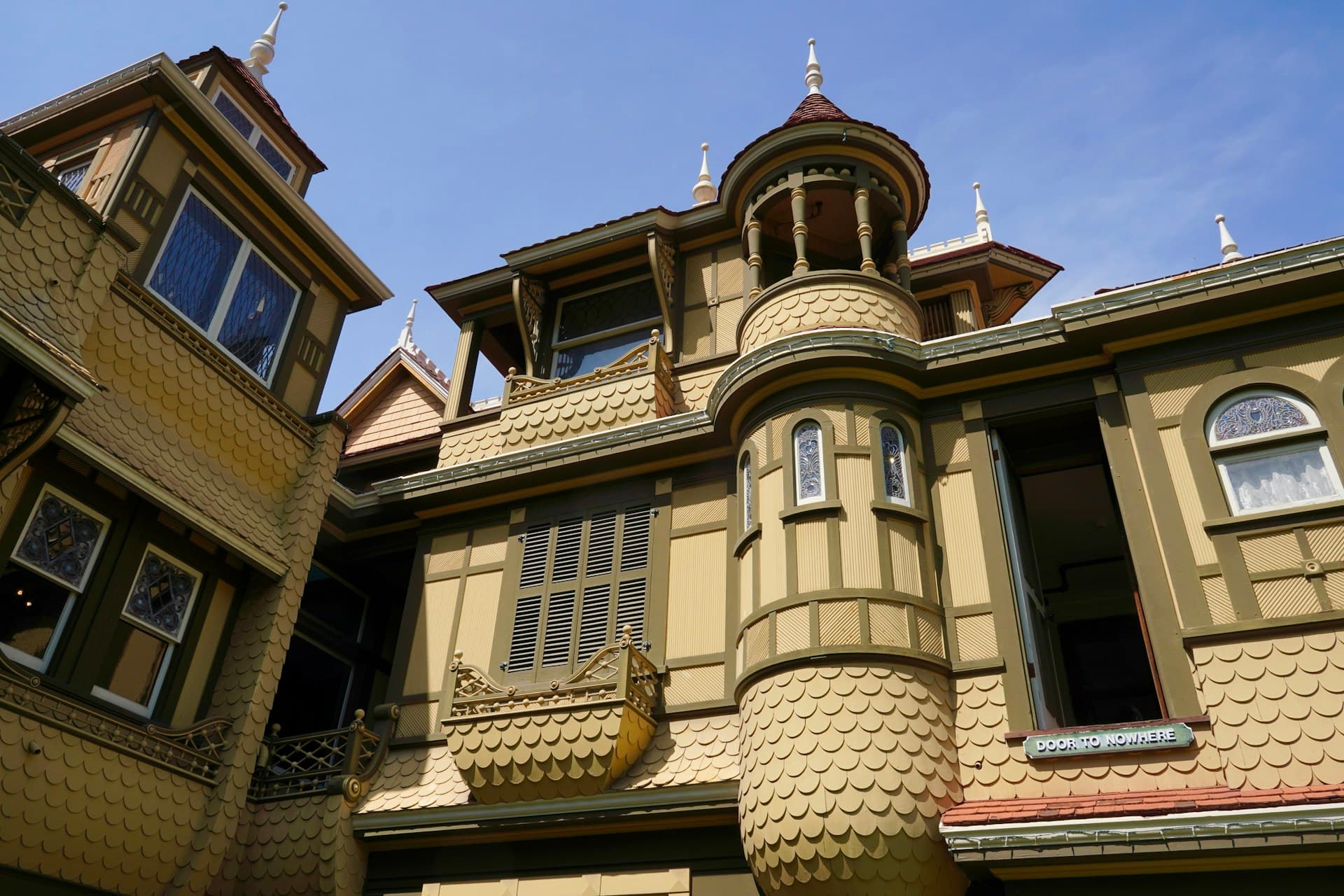 Winchester Mystery House Victorian architecture with ornate turret and roofing details in San Jose