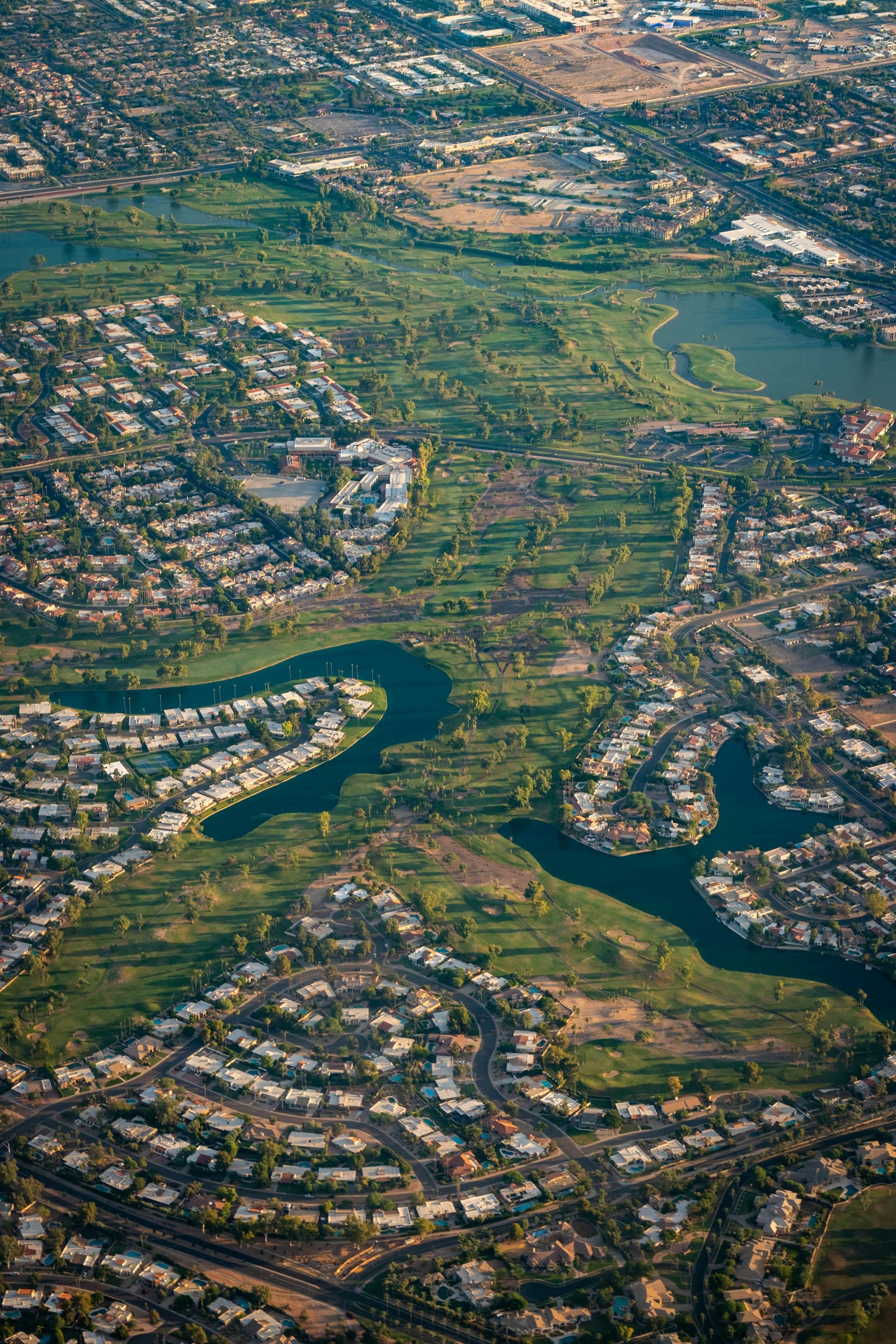 Aerial view of Scottsdale Arizona showing golf courses, lakes, and residential neighborhoods