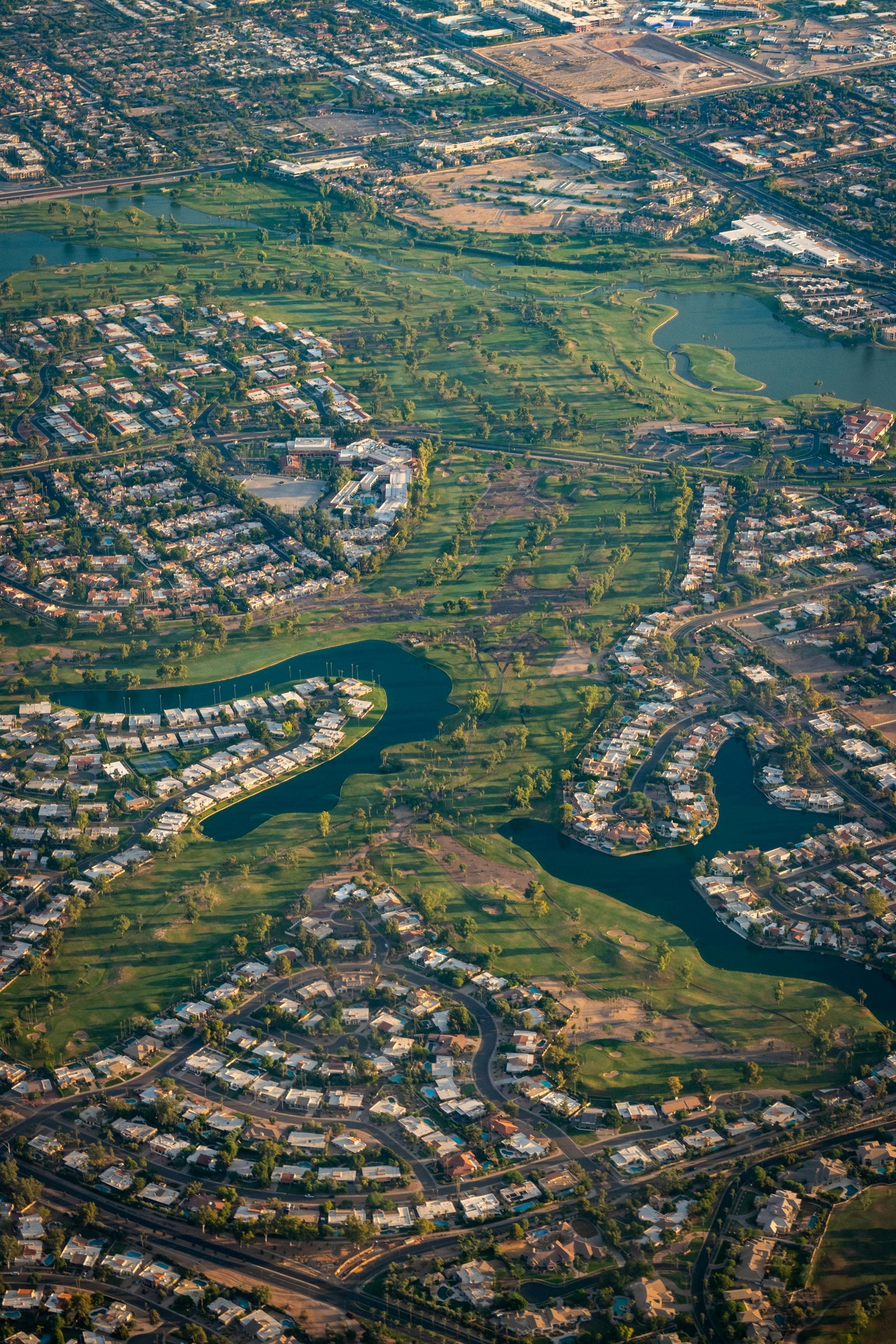 Aerial view of Scottsdale Arizona showing golf courses, lakes, and residential neighborhoods