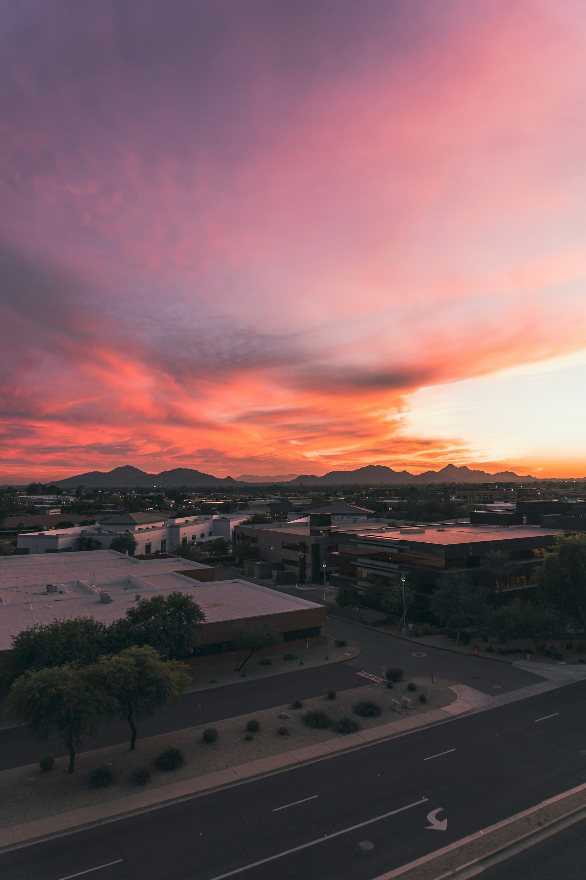 Scottsdale Arizona sunset view with mountains and flat roof buildings
