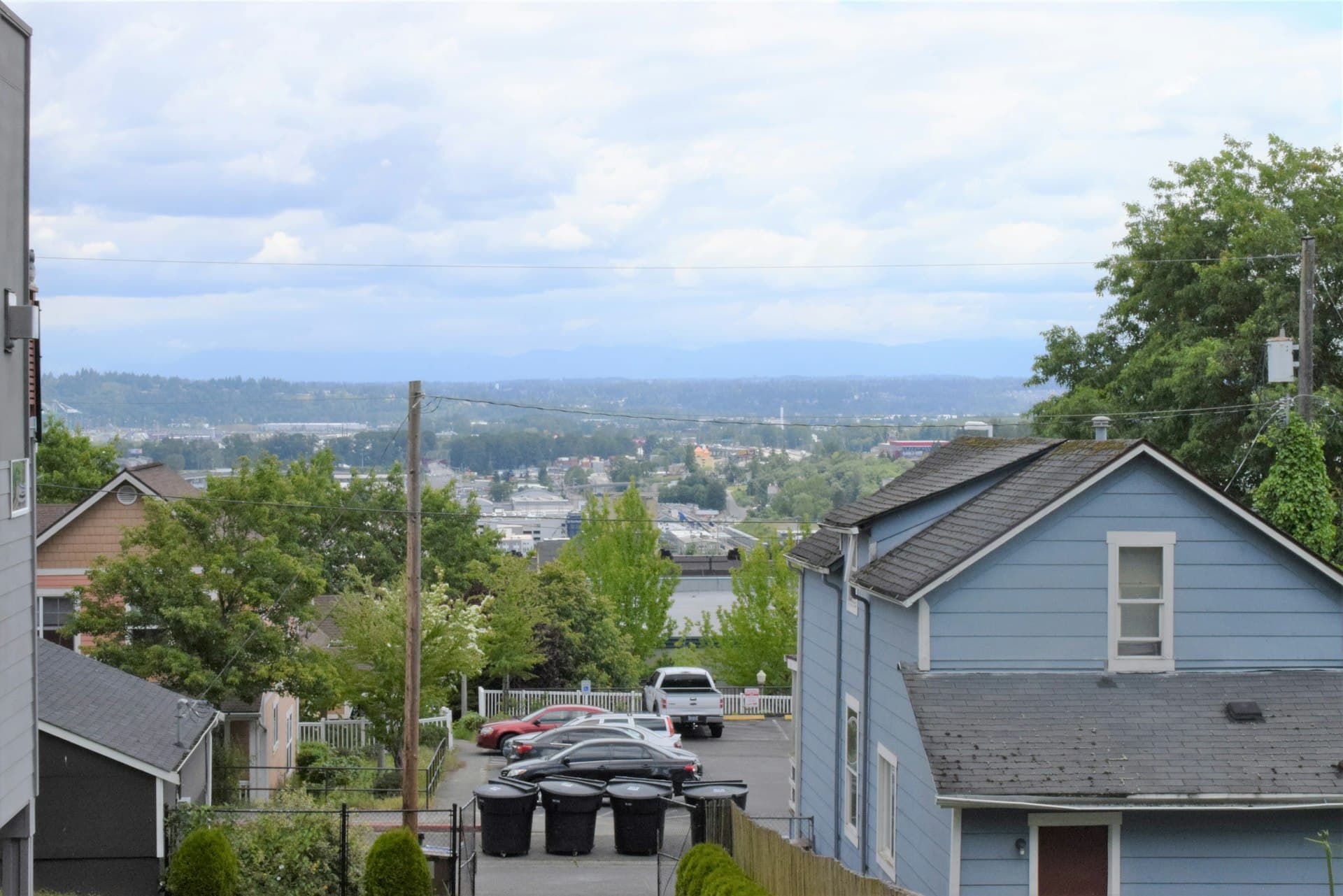 View of Tacoma Washington residential neighborhood with rooftops and mountains