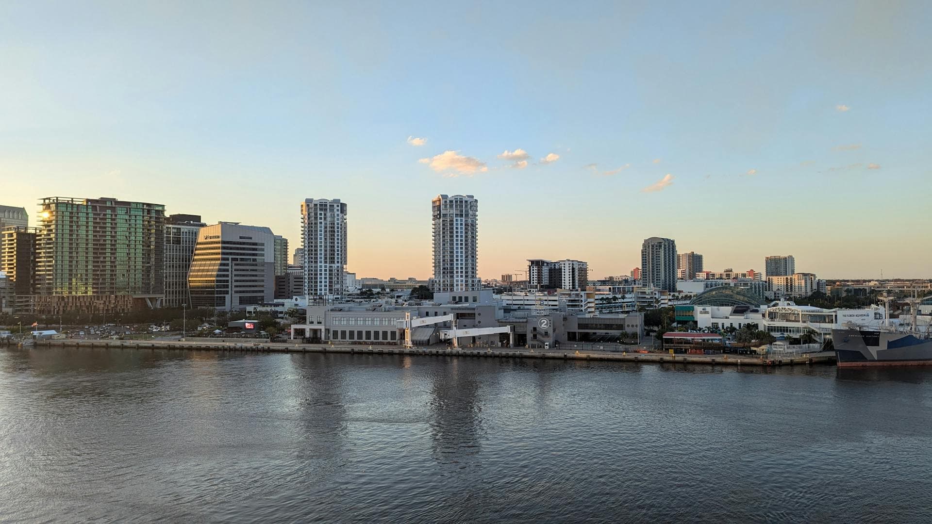 Tampa Bay skyline at sunset with waterfront and high-rise buildings